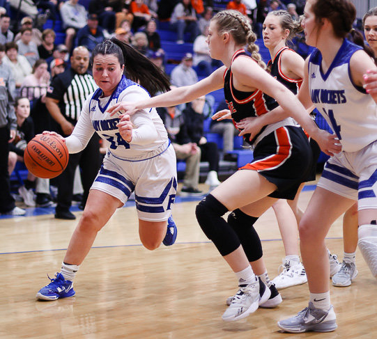 Senior Carli Warner drives to the hoop for the Lady Rockets. Warner ended with six points.&nbsp;