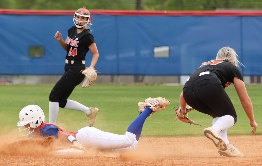 Macyn Kirby slides safely into second on a steal.