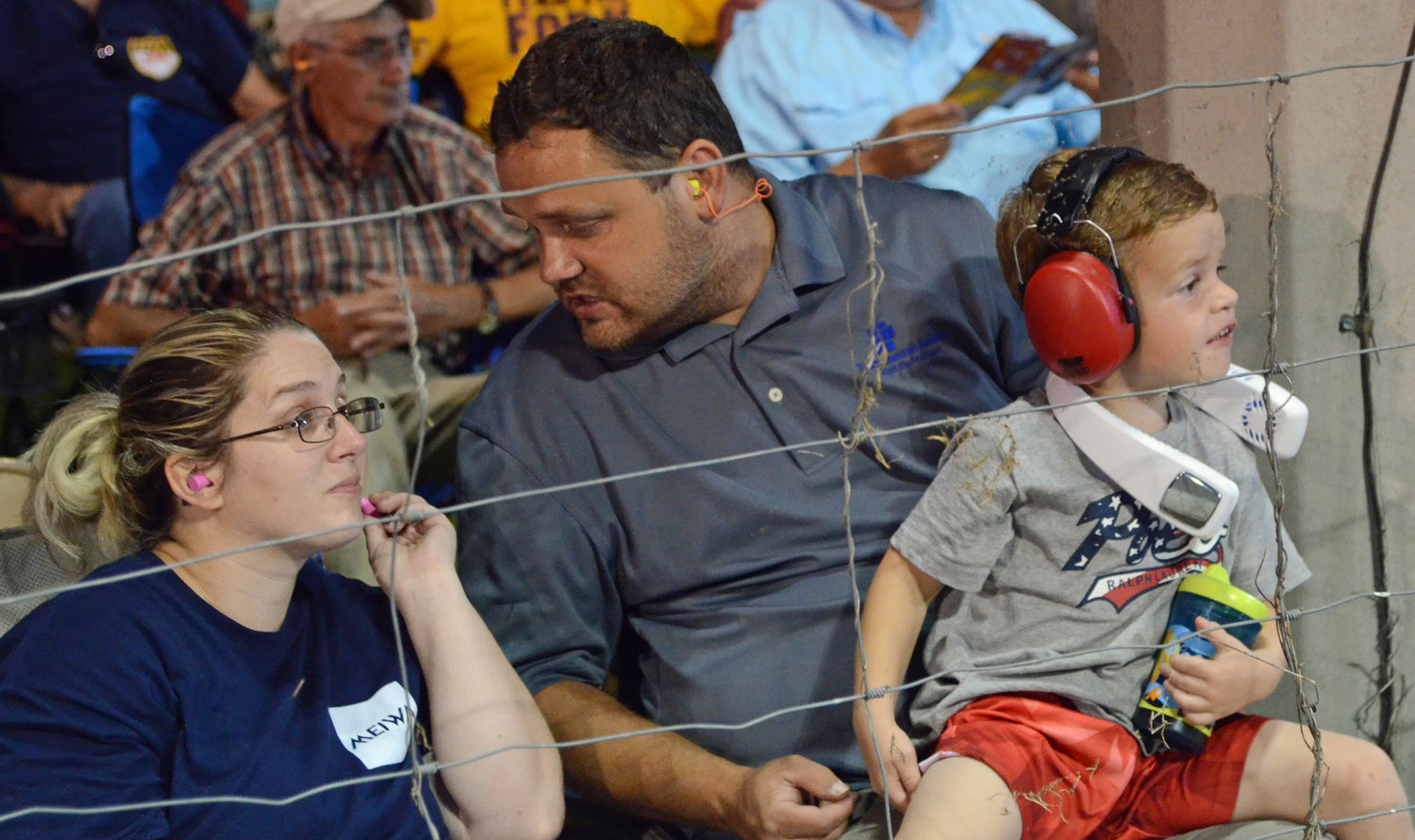 A young fan enjoying the show with his parents Friday night at Chapel Hill.