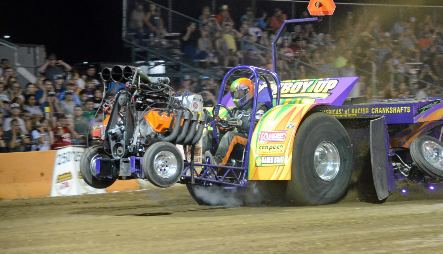 Rotella?s Adam Bauer took first place Saturday night in his Cowboy Up 2,050 pound Open Modified Mini Tractor.