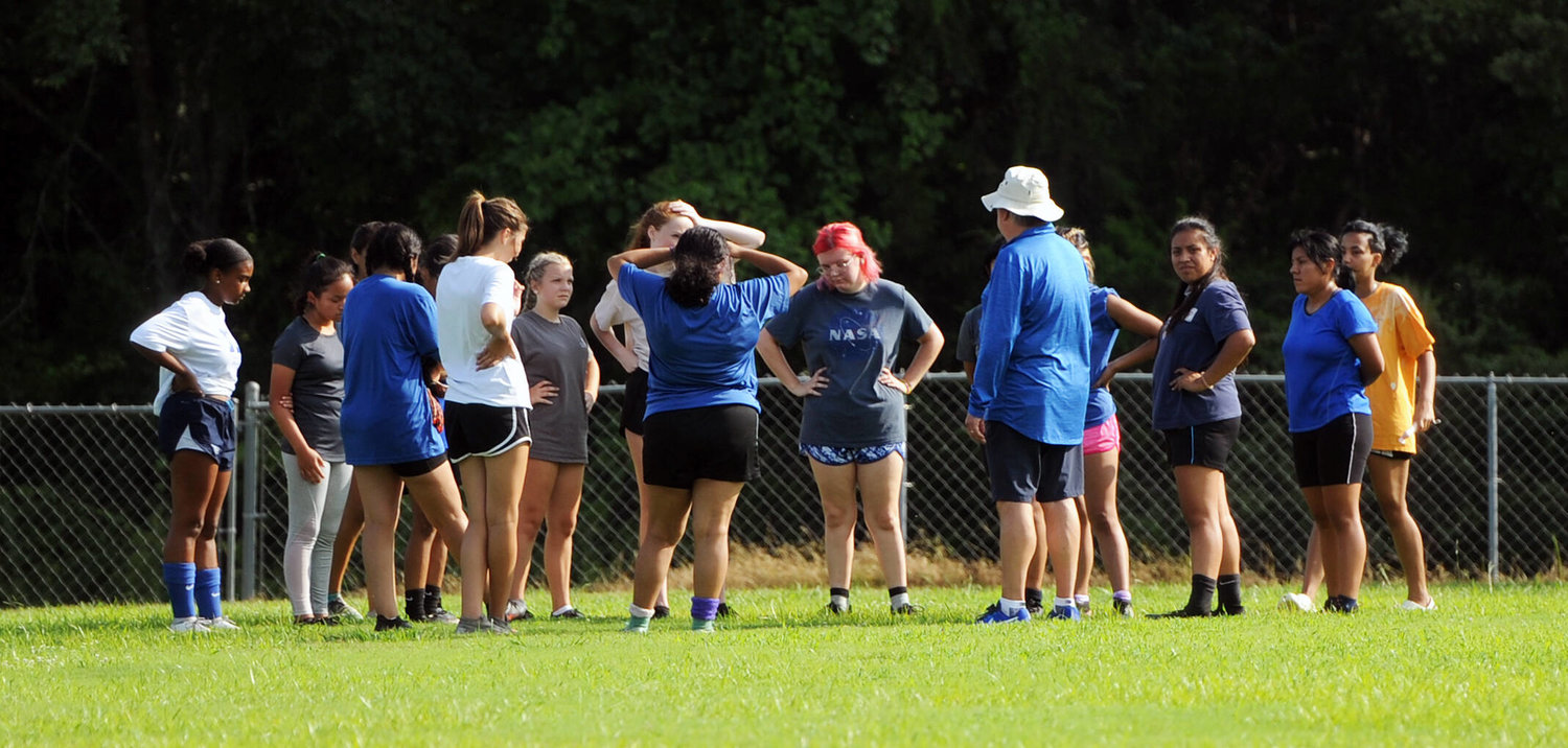 The Tigerettes huddle up after a recent practice.