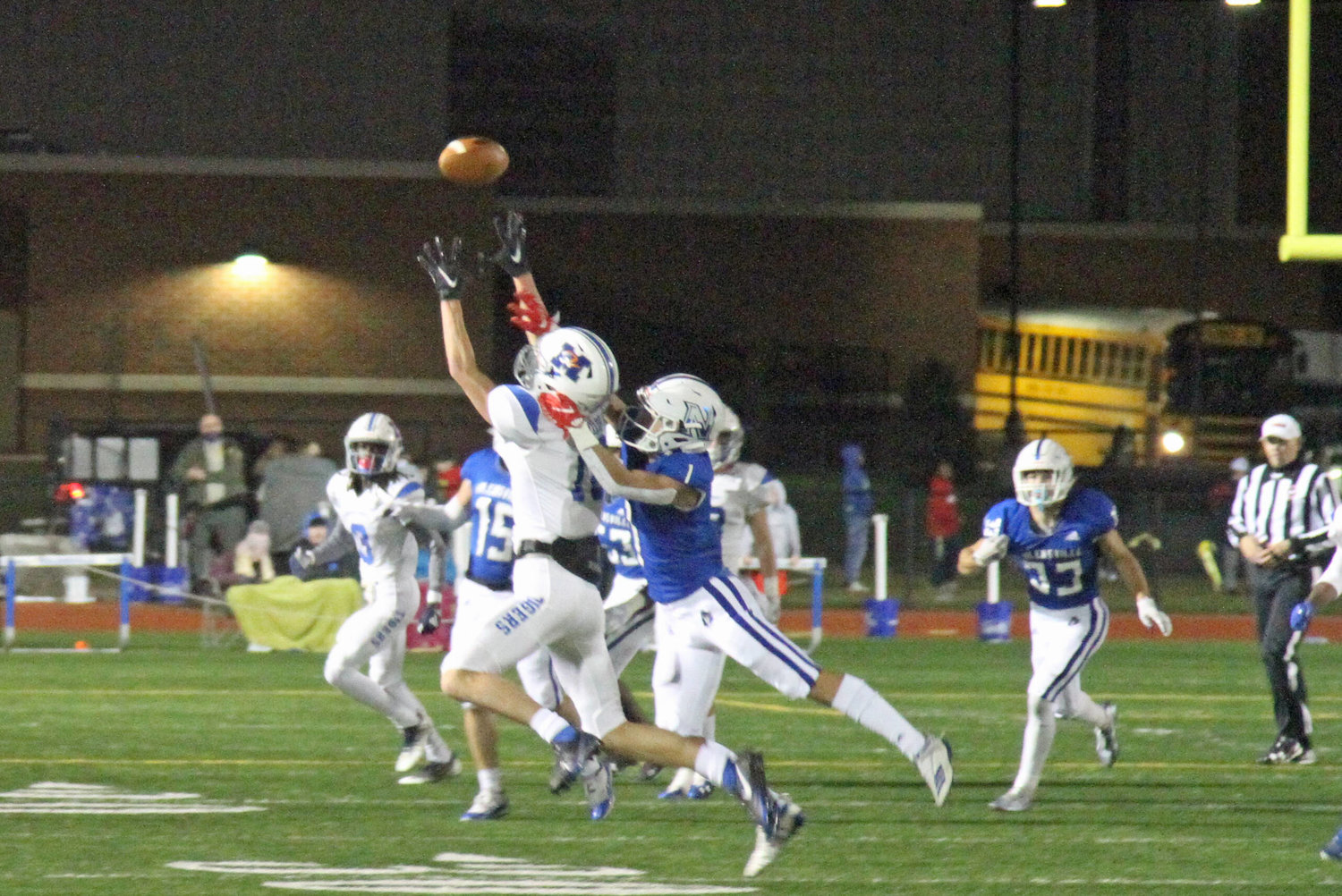 Christian Stacey goes up high for a Bryson Hammons pass in the Tigers’ 35-28 loss at Nolensville Friday night.