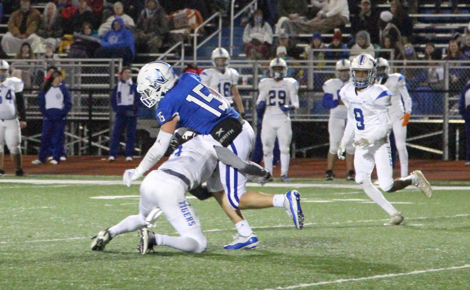 Devonte Davis executes an open field tackle on the Nolensville’s Brayden Rose (15) during the Tigers’ 35-28 loss on Friday night.