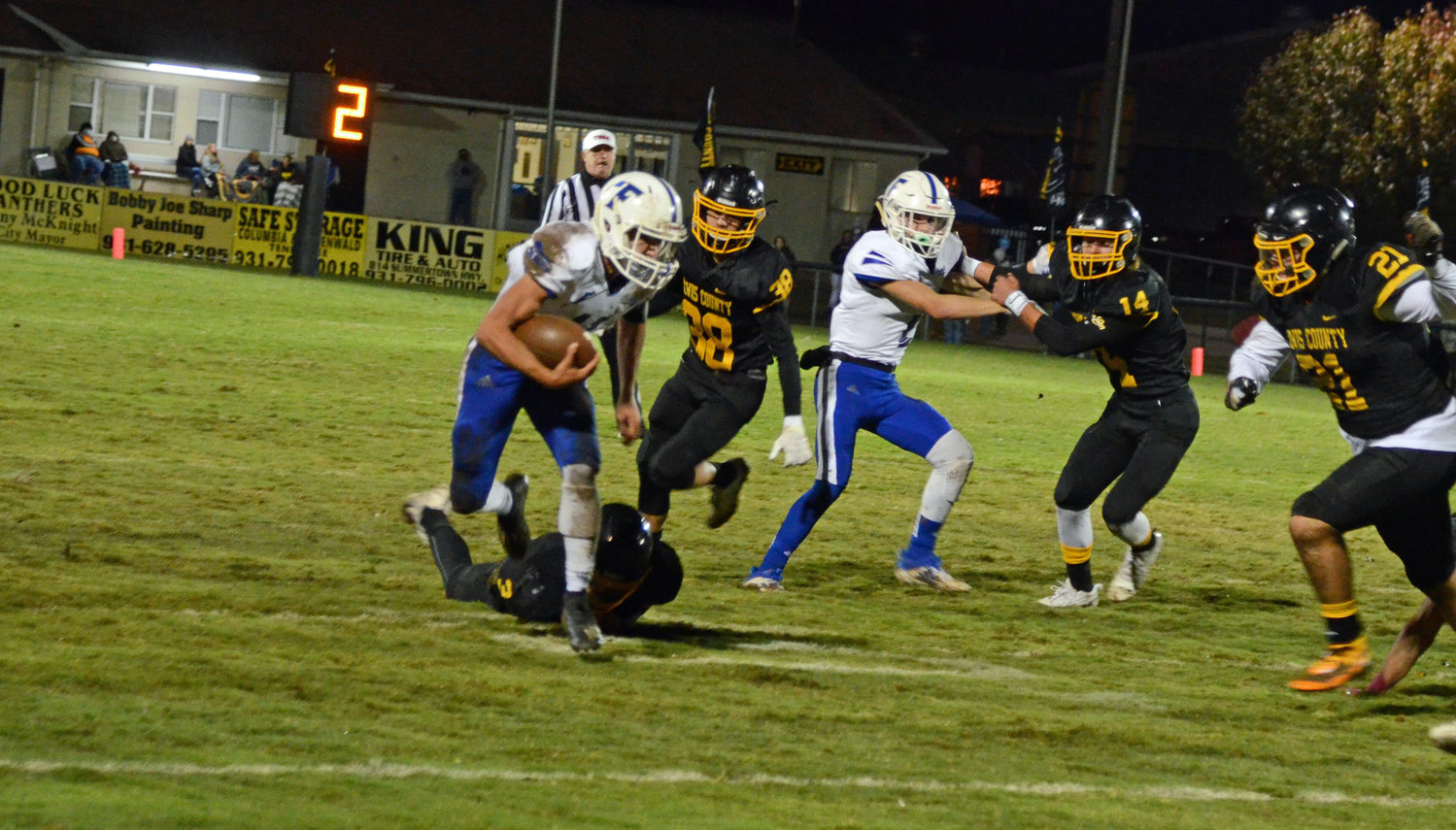 Brenton Burchell sheds a Lewis County tackler before breaking to the outside for a big 21-yard first quarter run.