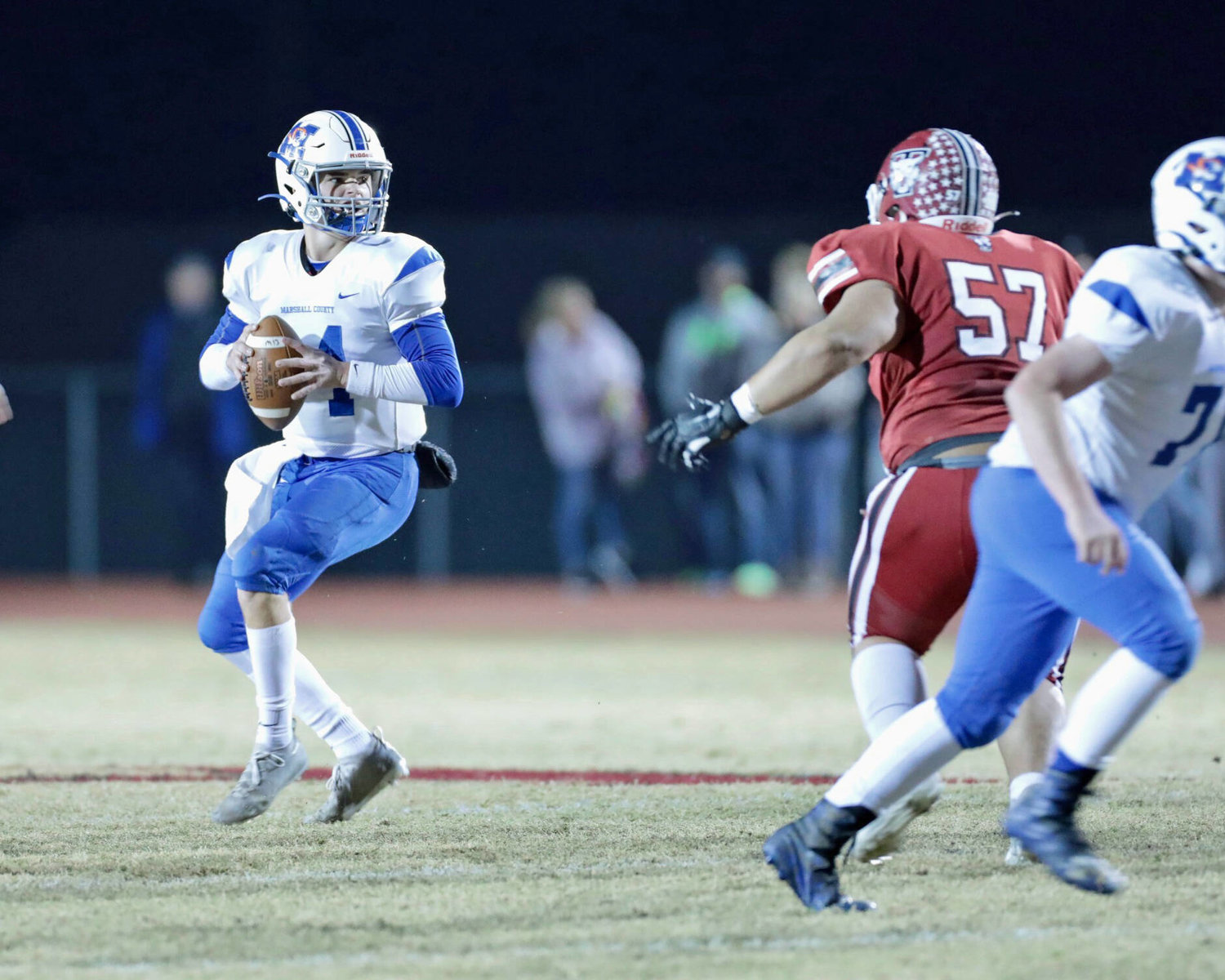 MCHS quarterback Bryson Hammons (14) drops back for a pass versus the Wildcats.