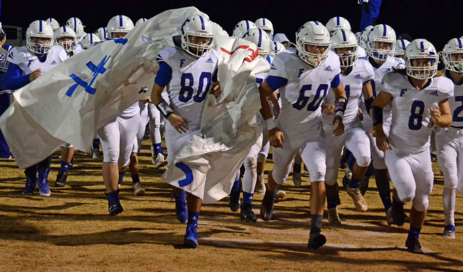 The Rockets run out before their Class 2A second round playoff game at Waverly Friday night.