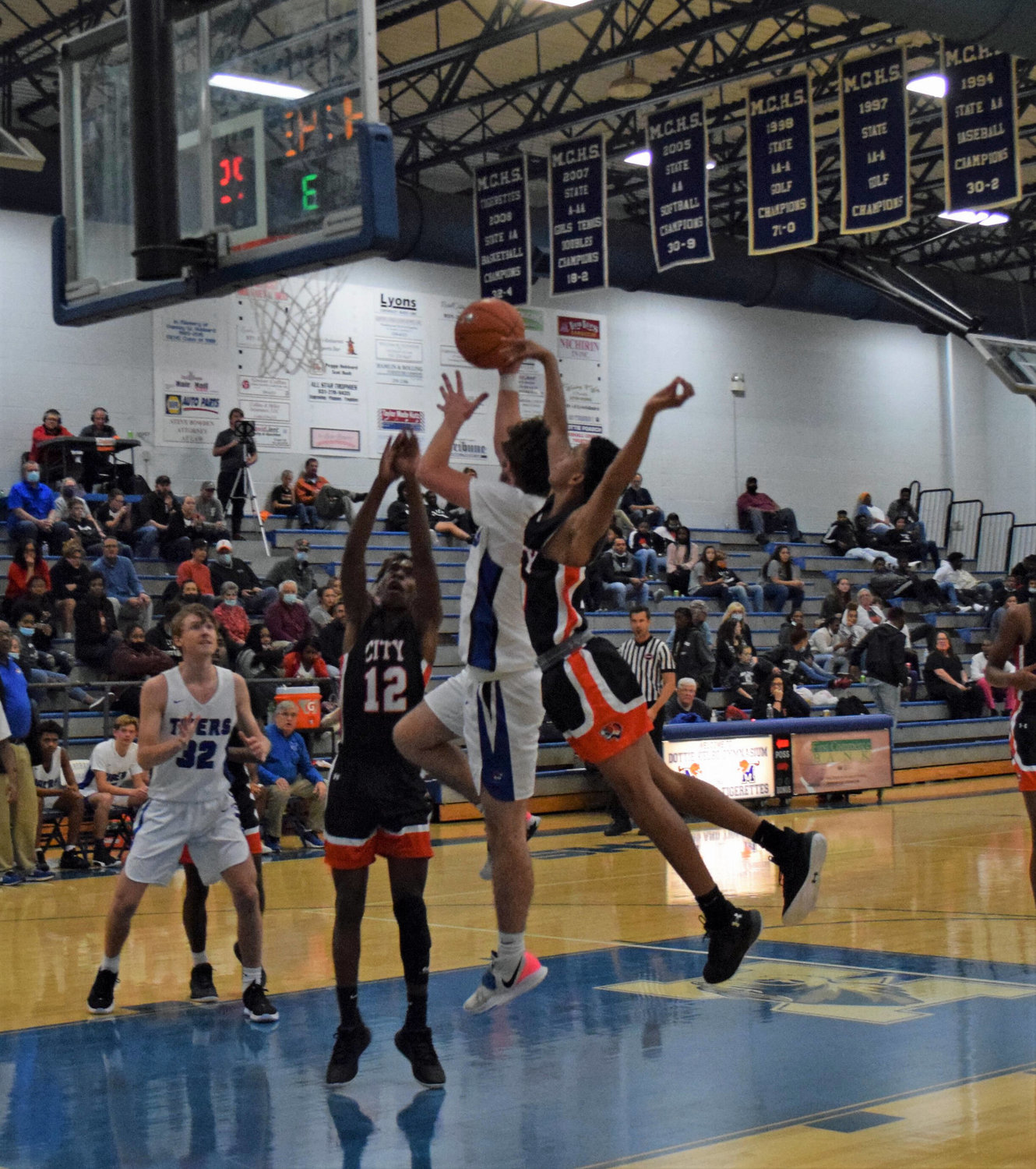 Marshall County senior Bryson Hughes goes up for two of his game-high 18 points in the Tigers’ first win of the season.
