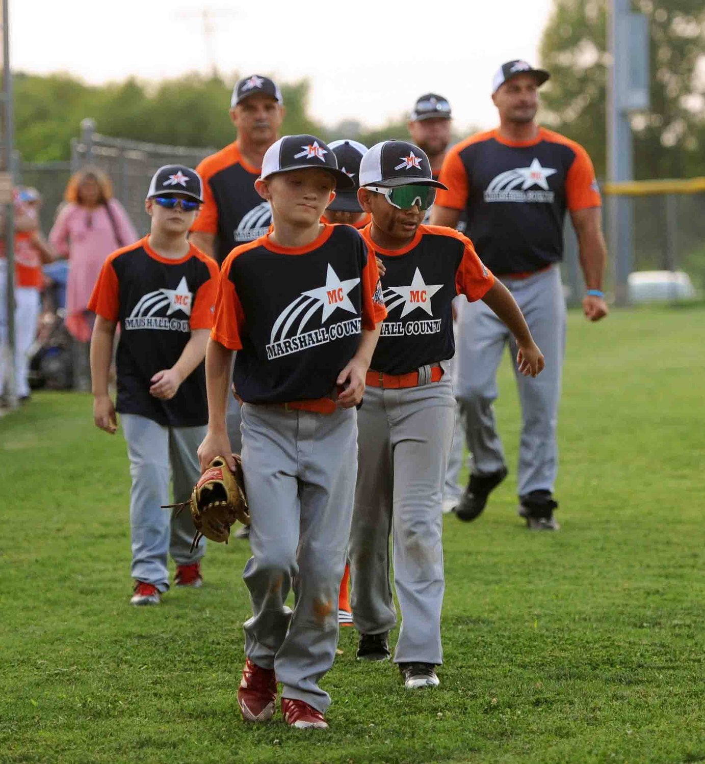 The 9-Year-Old Marshall County team makes its way onto the field for the opening ceremony after playing their first game in the tournament.