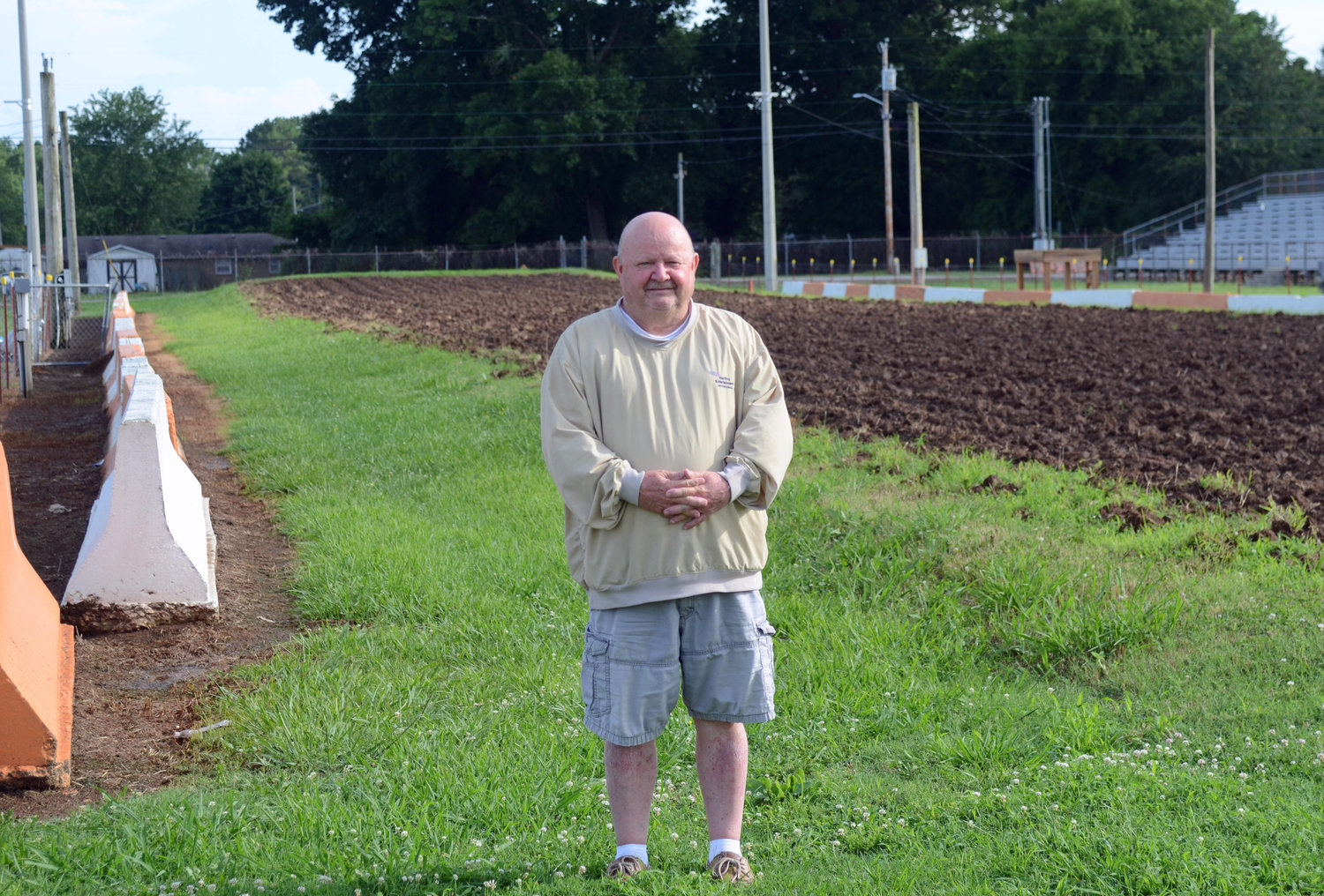 Lions Club president Ricky “Goose” Sweeney stands in front of the freshly turned over track surface at the Lions Club Motorsports Park that is always carefully manicured and readied for racing by Ken Lamb and his grounds crew.