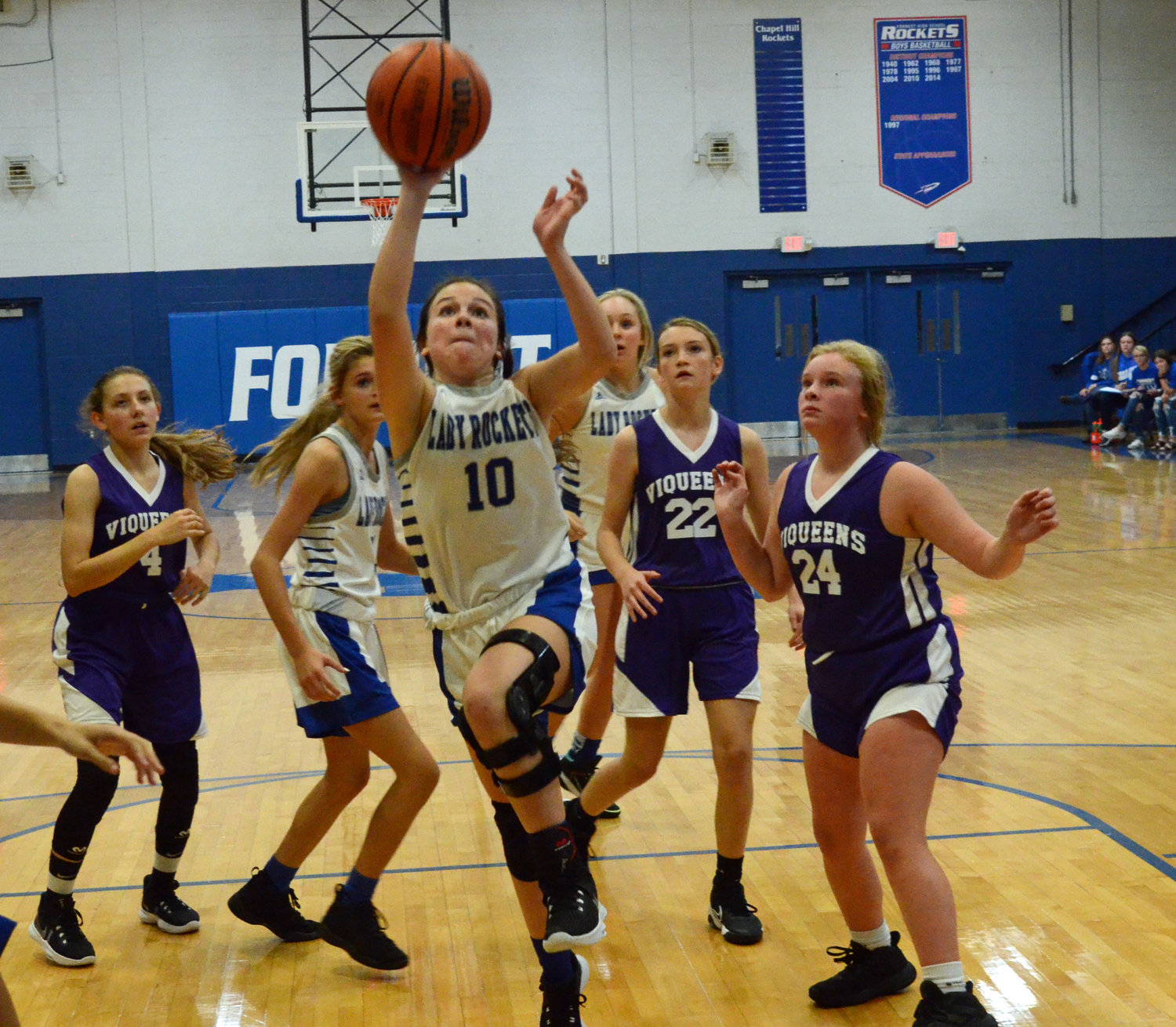 Camreigh Warner (10) drives down the lane for two points in the second quarter for the Lady Rockets.