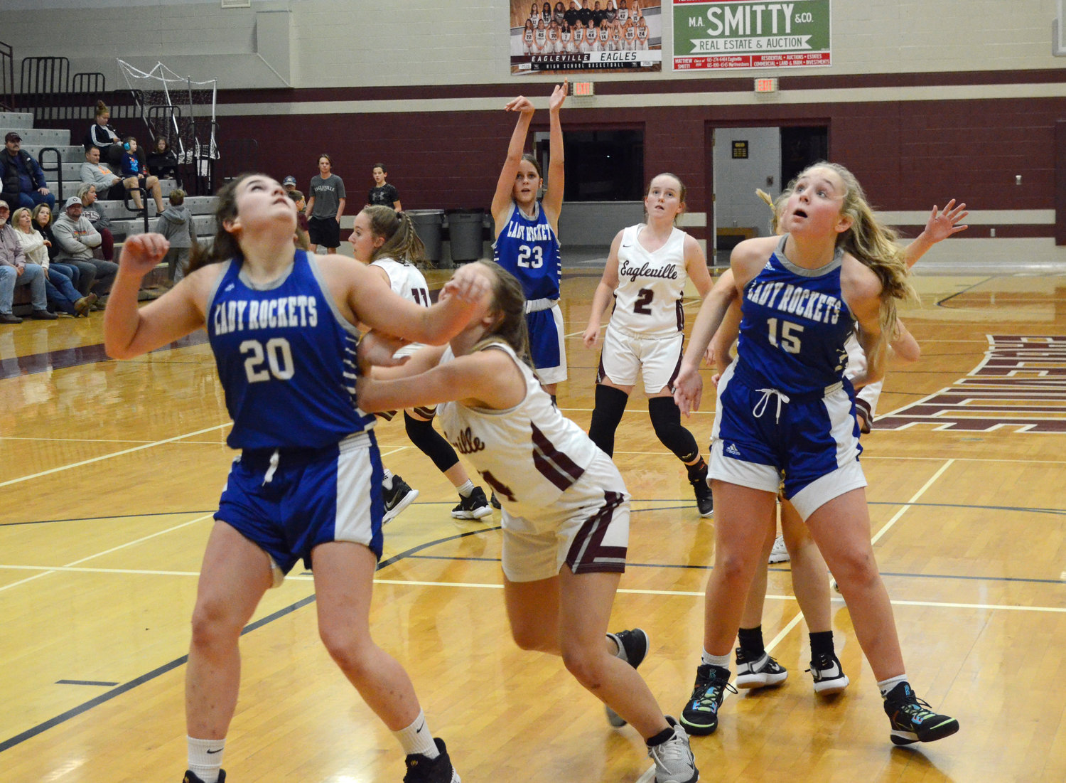Lindsey Lee (20) and Josie Brown (15) box out as Sadie Smith (23) puts up a shot.