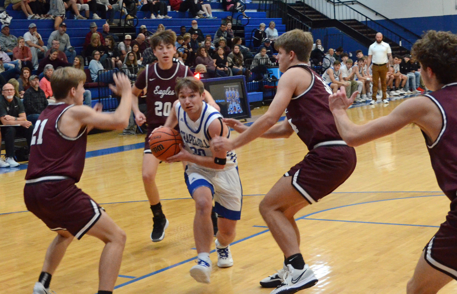 Andrew Timmons (30) drives through the entire Eagleville defense on his way to a layup and two of his team-high 13 points in the contest.