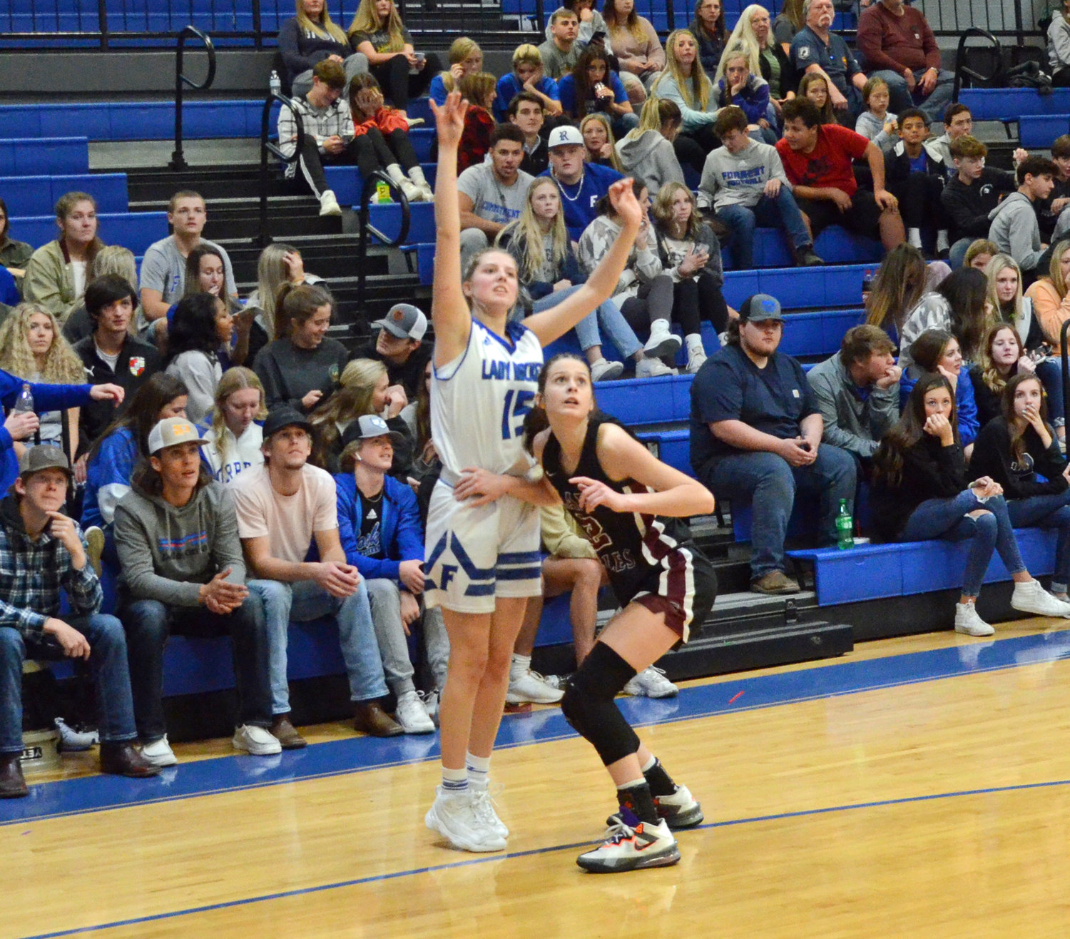 Forrest’s Megan Mealer drains one of her two fourth quarter 3-pointers in the Lady Rockets’ 51-36 loss to Eagleville Tuesday night at Chapel Hill.