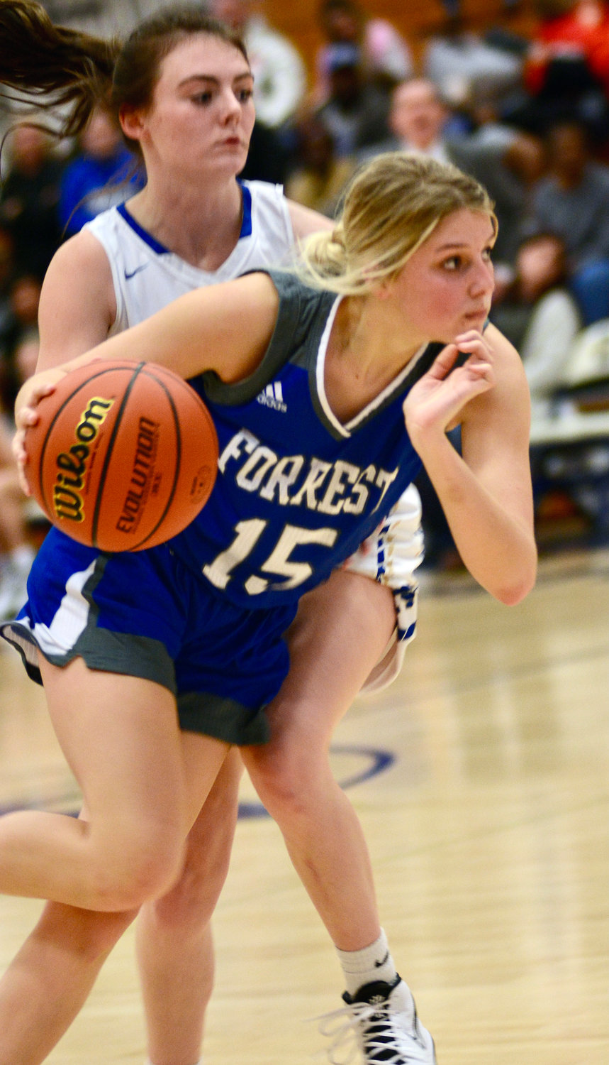 Lady Rocket Megan Mealer makes a move to the basket in a matchup at Shelbyville Central on Tuesday evening.