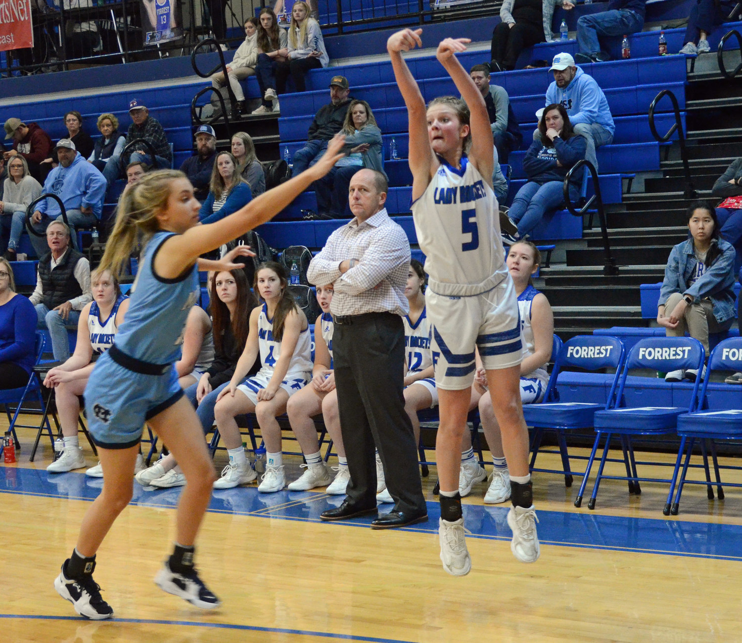 Macyn Kirby (5) launches a 3-pointer in Forrest’s 52-41 loss to Moore County Tuesday night at Chapel Hill.