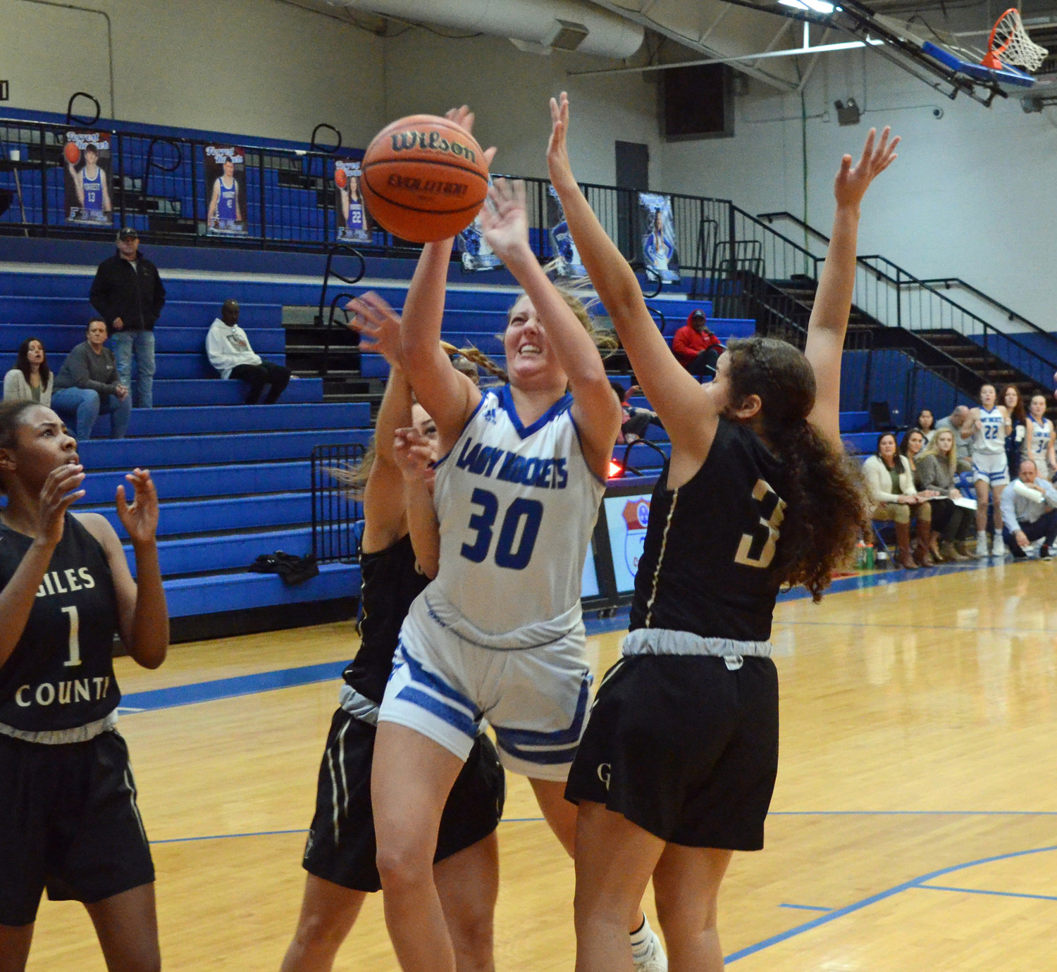 Senior Ryann Lewis (30), who scored a career-high 14 points, takes the ball strong to the hoop versus the Lady Bobcats Friday night at Chapel Hill.