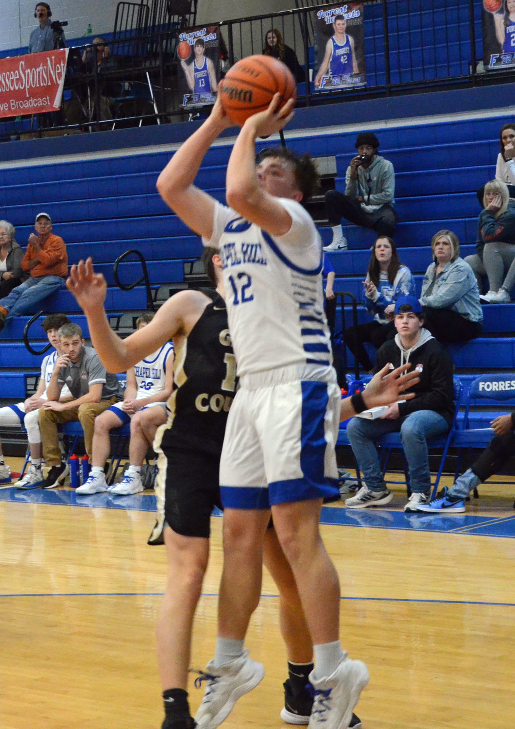 Brennan Mealer (12) pulls up for a jumper on the baseline for two of his 10 points in the game.