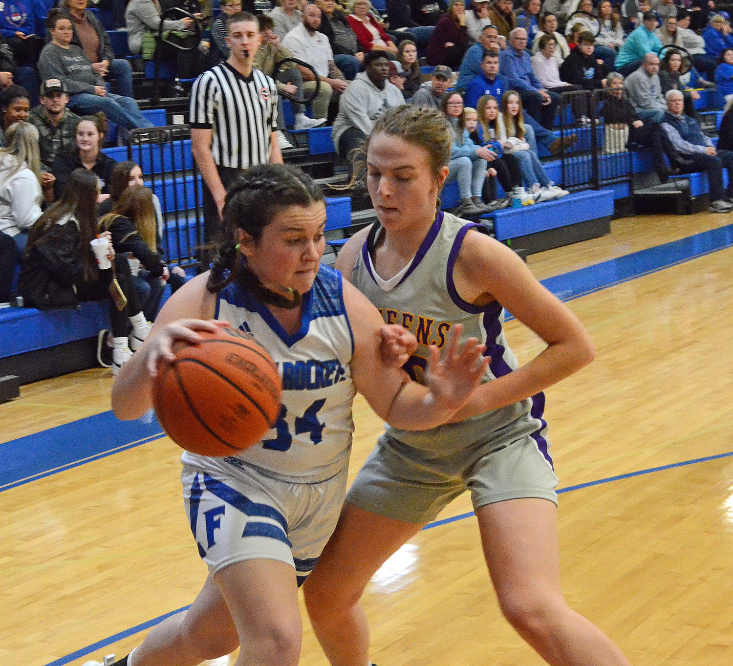 Carli Warner (34) drives the baseline for the Lady Rockets, who lost 48-29 to the Community Viqueens in Friday night’s District 7-AA opener at Forrest.