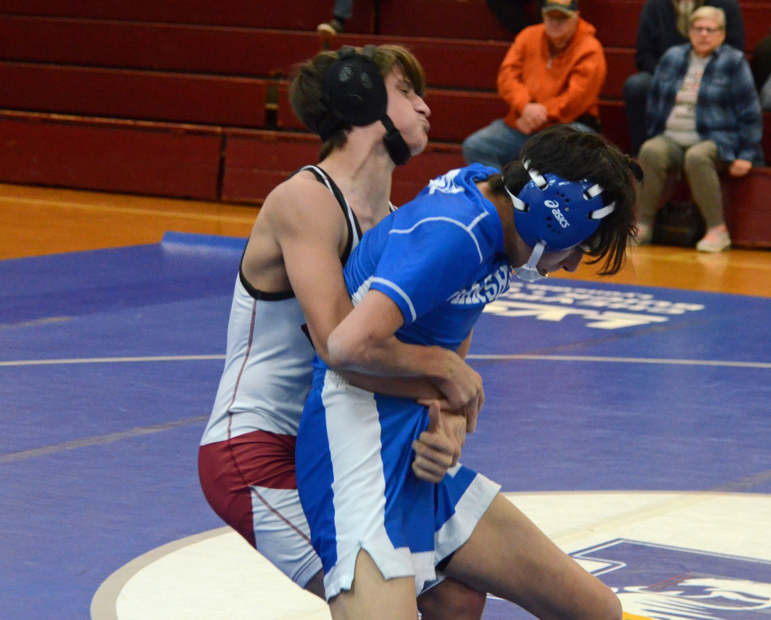 Cornersville’s Joshua Bennett gets a good hold on Marshall County’s Julius Foster in the 106-pound weight class.