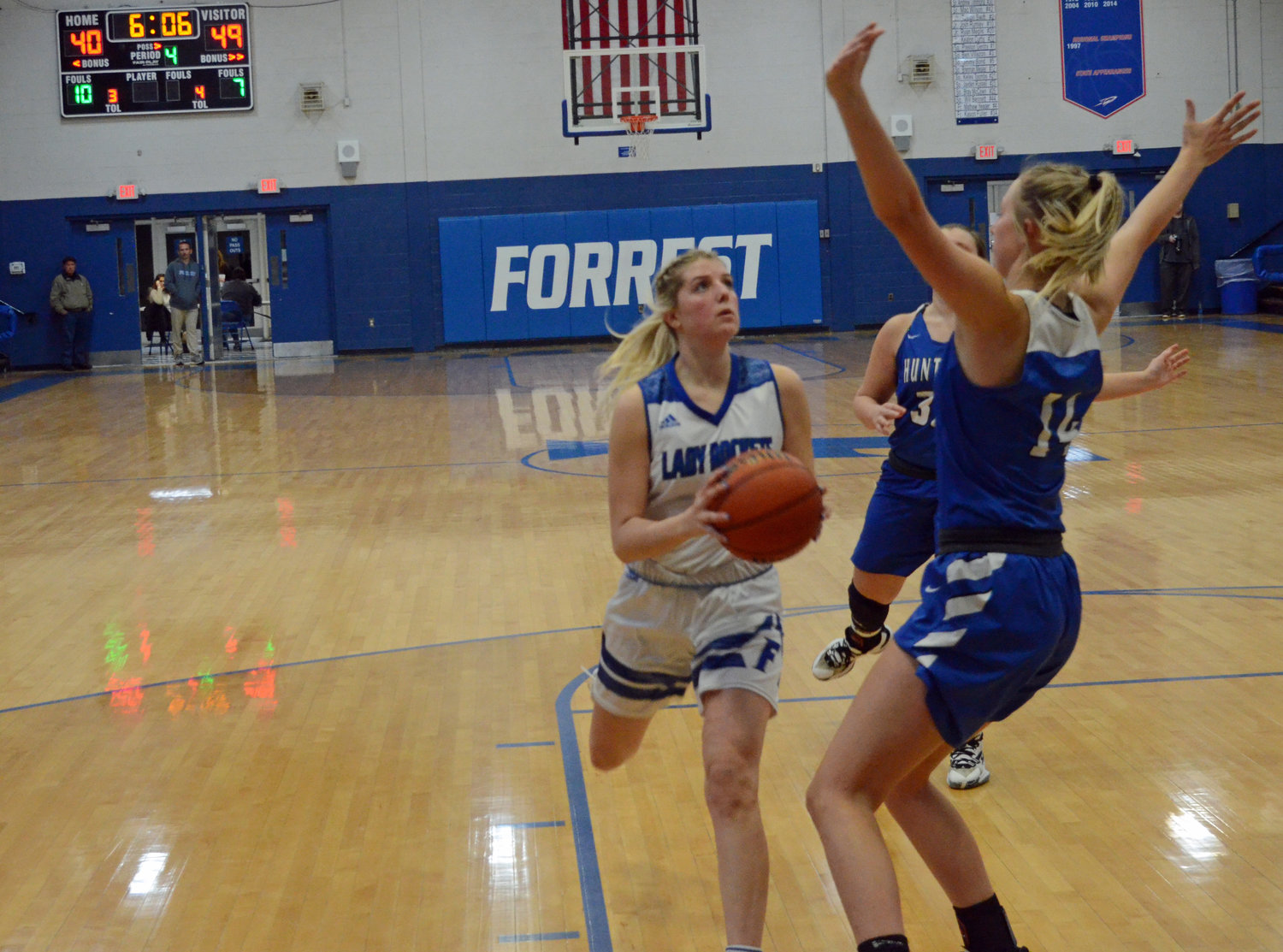 Megan Mealer (15) drives to the hoop for a score, making it a seven-point game in the fourth quarter.