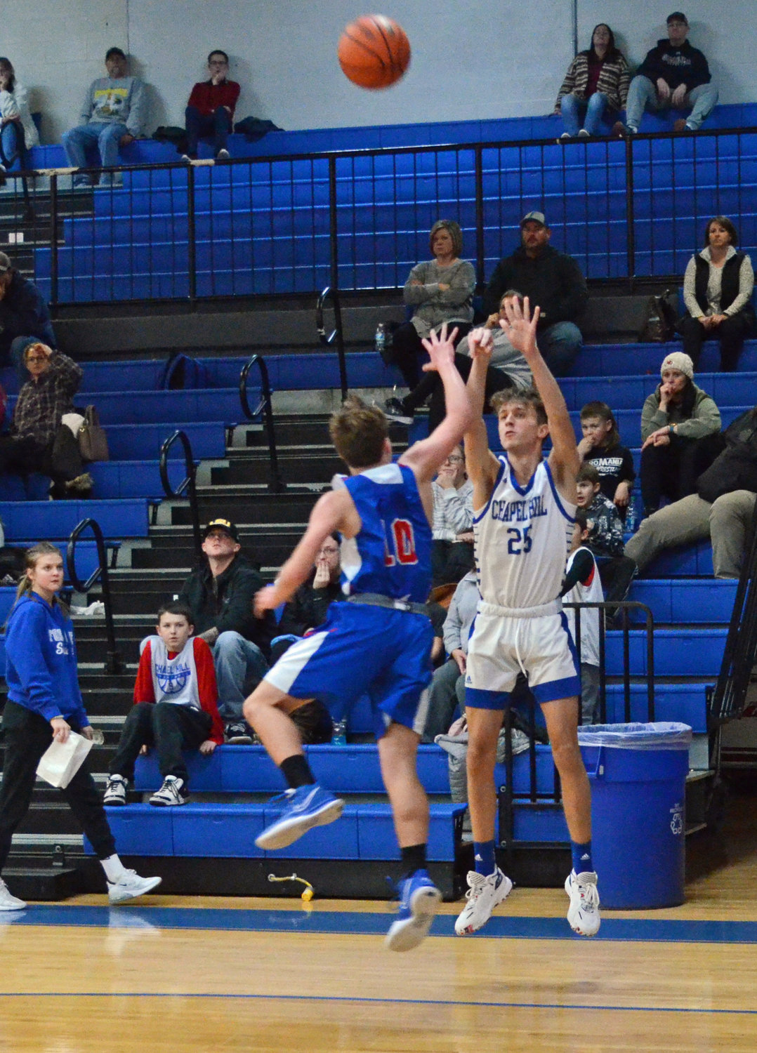 Bray McCown (25) buries a 3-pointer to cut the Huntland lead to three points at halftime.