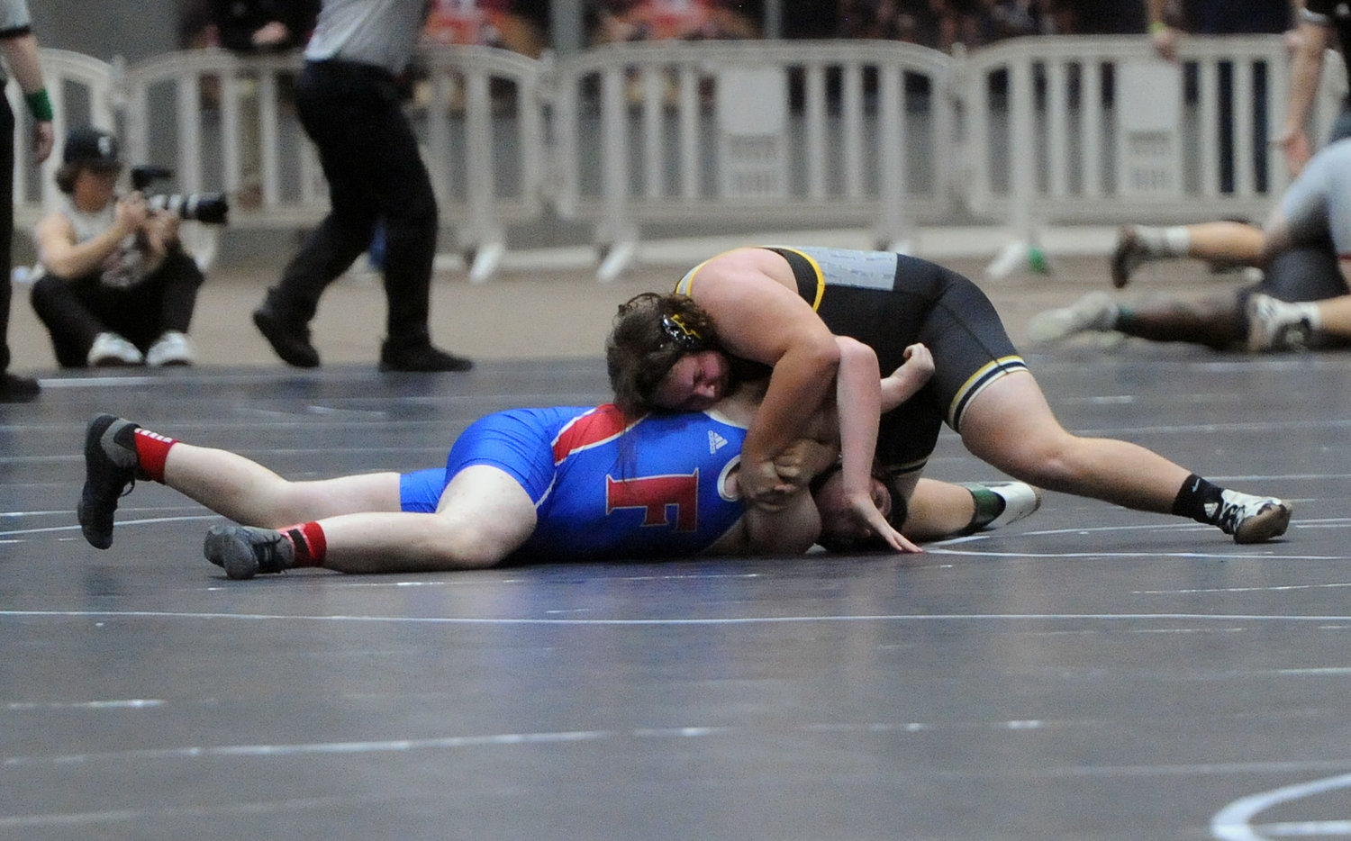 Nathan Hall battles Hixon’s Landon Moore in the opening round on Thursday.
