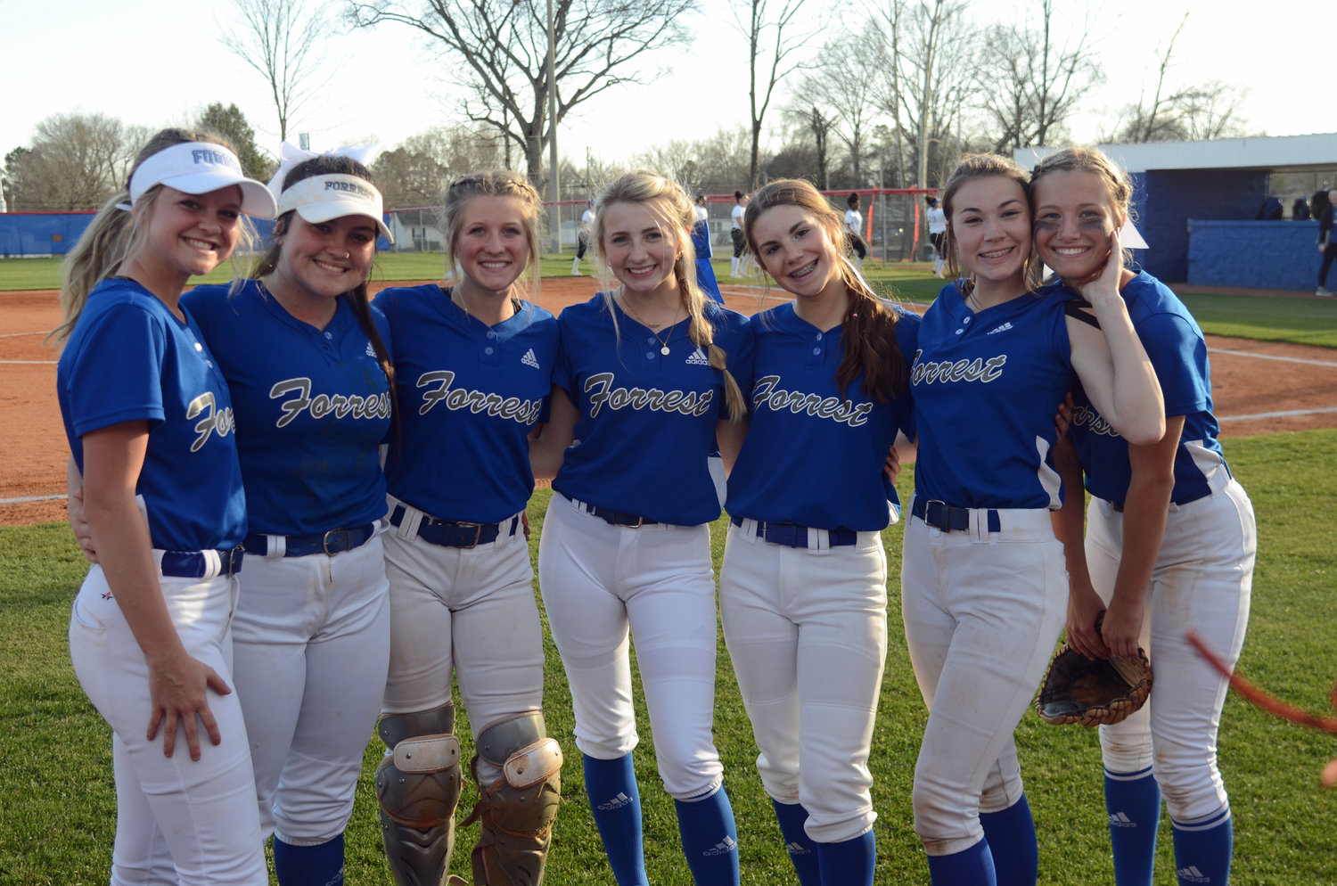 The Lady Rockets are all smiles as they get ready to play their home opener Thursday night.