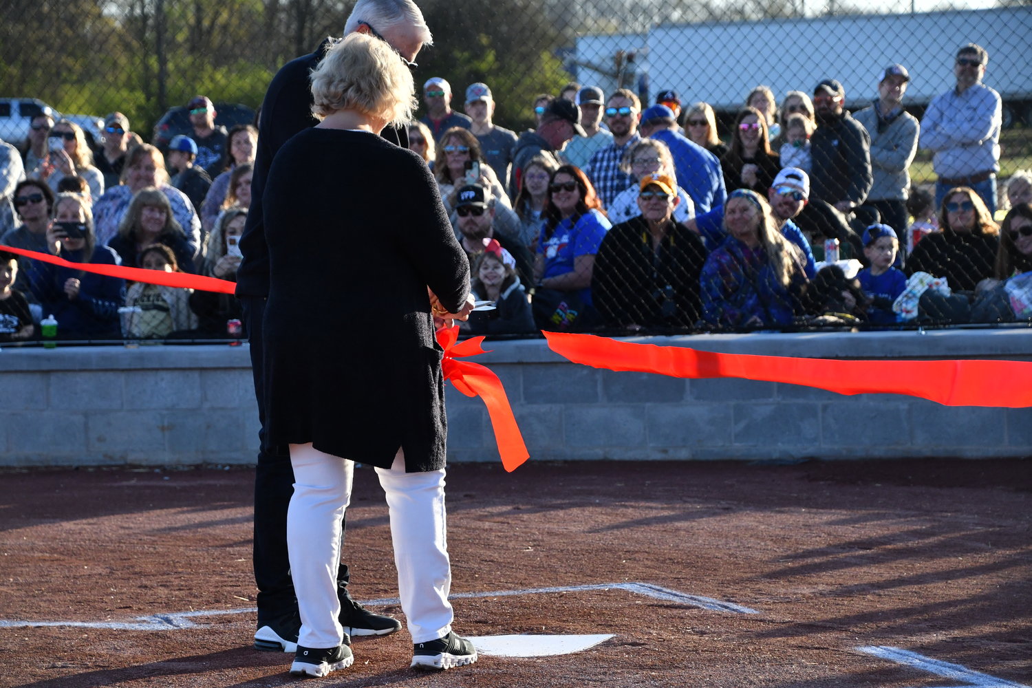 Shirley and Michael Minor, the parents of former Forrest High School athlete and Cincinnati Reds pitcher Mike Minor, cut the ribbon at the opening ceremonies.