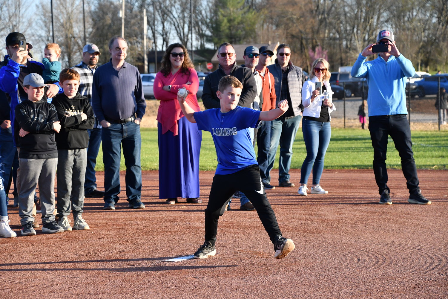Reid Brown, the son of the late Ross Brown, throws out the first pitch on the field which bears the name of his father.