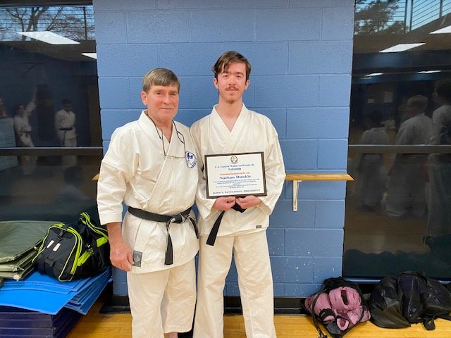 Nathan Dunkle, a student of Sensei Carter’s, was awarded the Student of the Year for the U. S. Eastern Wado-Ryu Federation. Dunkle started under Mr. Carter in 2013 and holds the rank of second degree black belt. He is a student at Cornersville High School.
Pictured are Roe Carter and Nathan Dunkle.