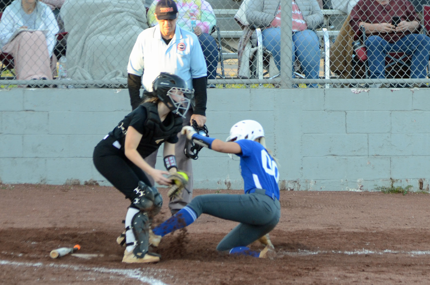 Abby Ferguson slides safely home to tie the game at 3-3 in the top of the third inning.
