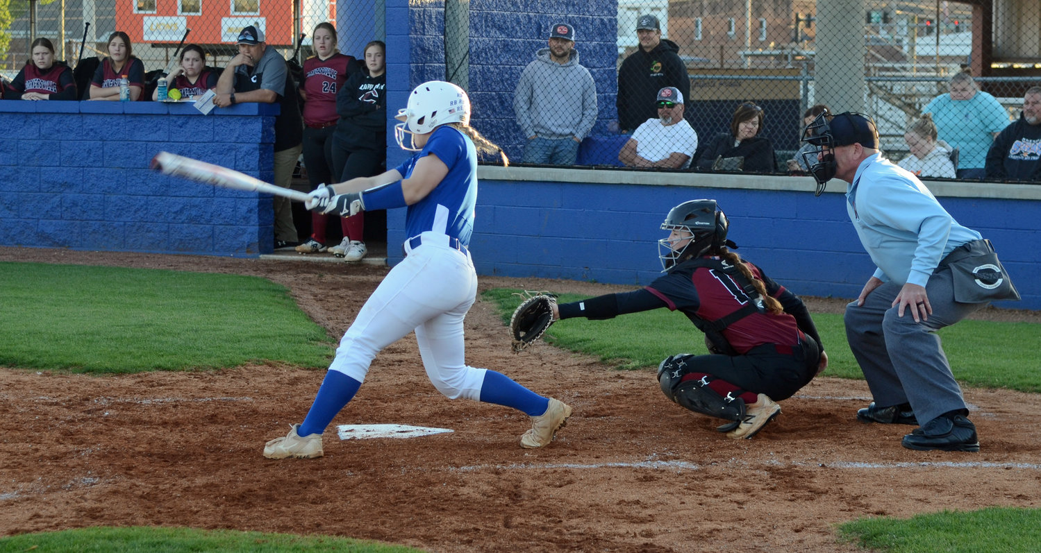Christa Warren slams a three-run homerun in the bottom of the fourth inning for the first of her two long bombs in the game.