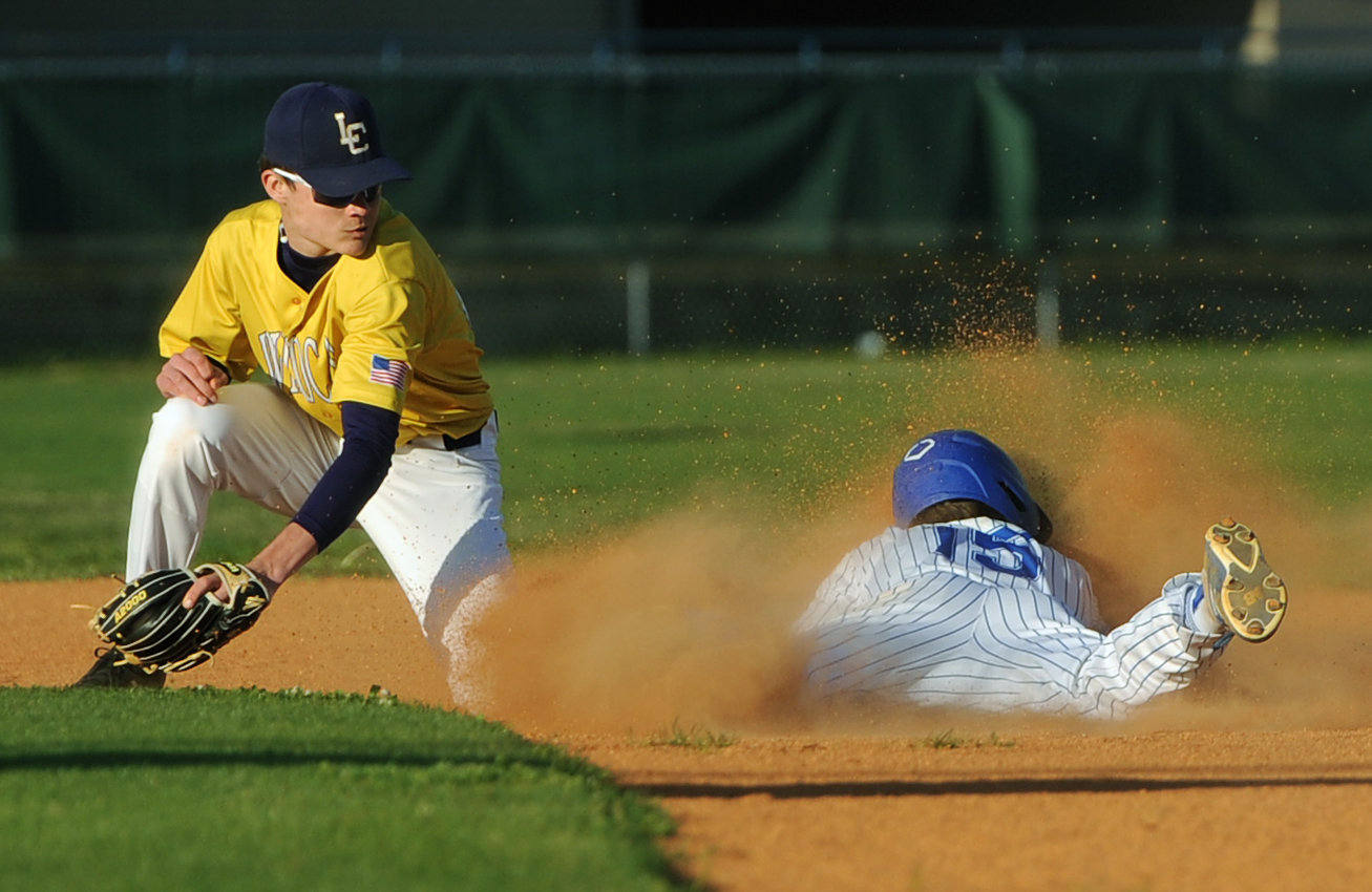 Trey Warner avoids the swipe and safely slides into second base against Lawrence County on Tuesday night.