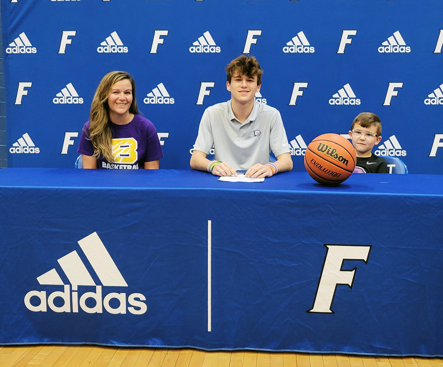 Deason Jones signs his letter of intent to continue his college career at Bethel University.