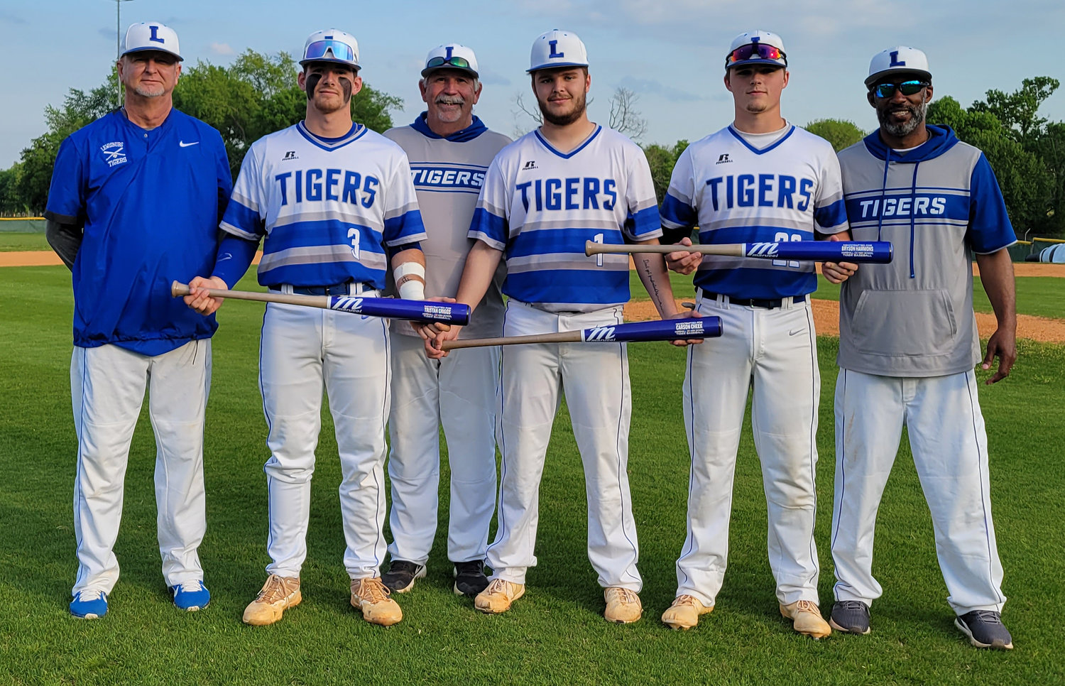 Prior to Friday night’s first pitch, Marshall County honored seniors (from left) Tristan Griggs, Carson Cheek and Bryson Hammons.