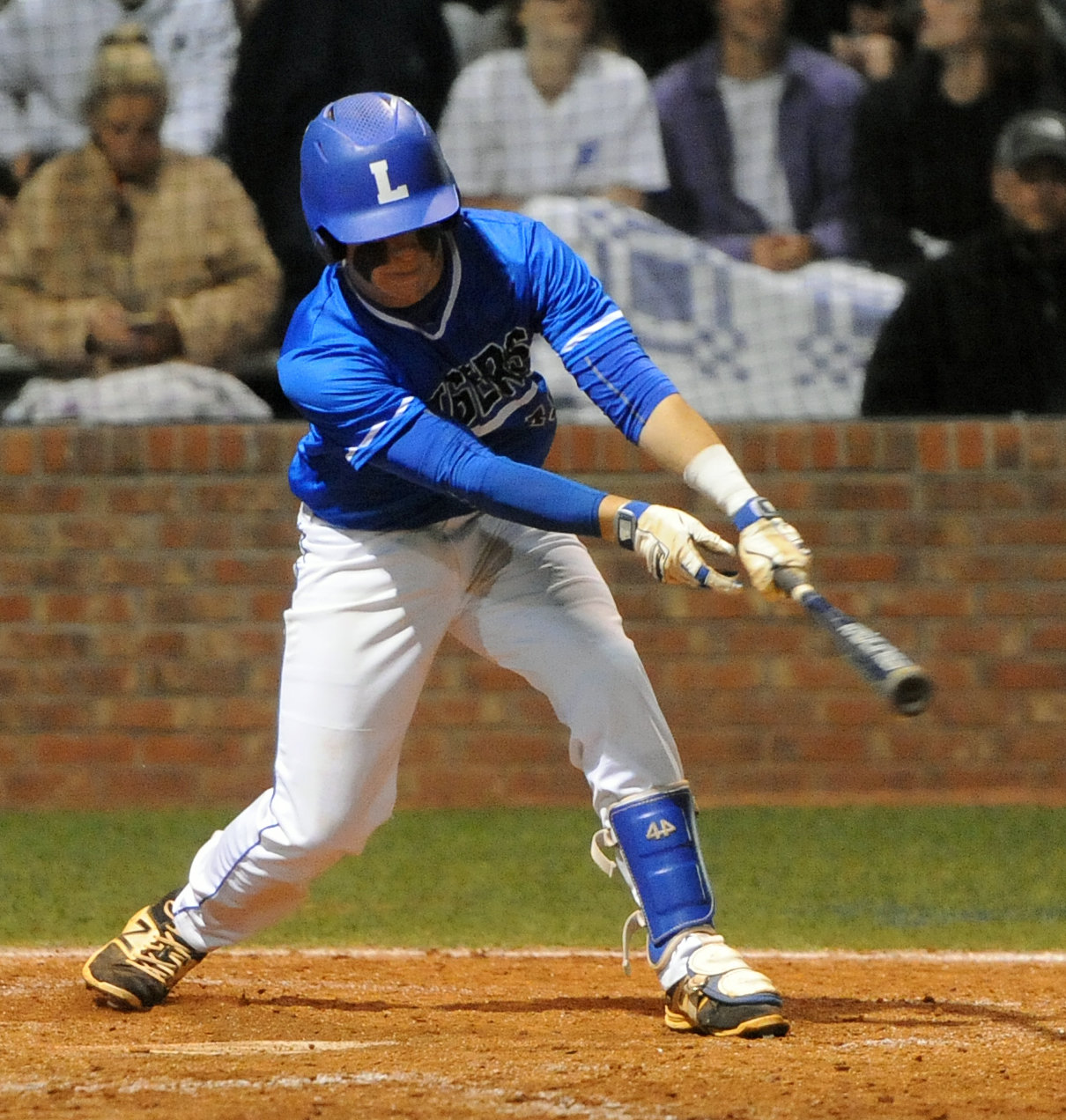 Trey Warner makes contact on a pitch and reaches base.