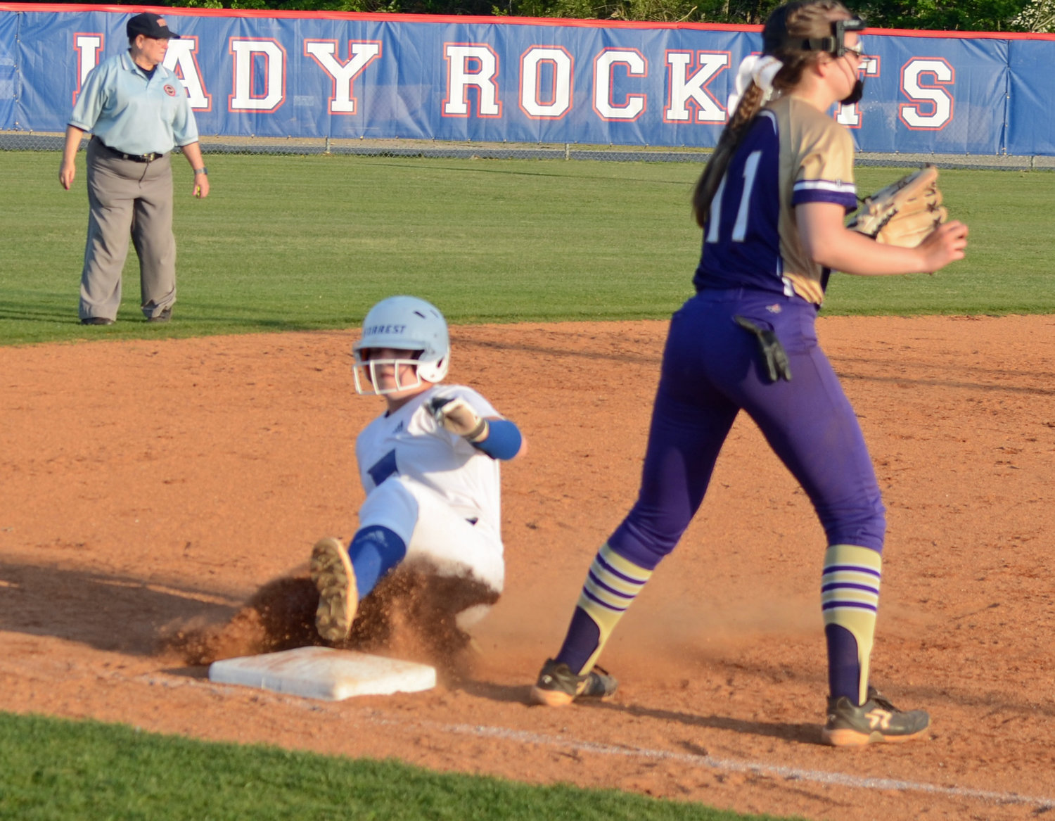 Christa Warren steals third base in the bottom of the second inning.