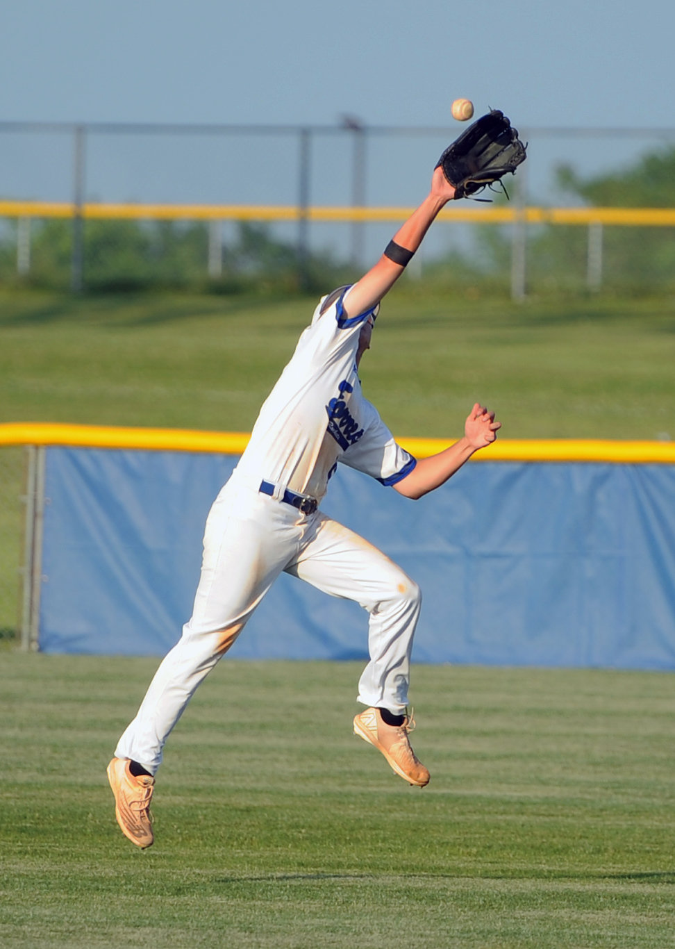 Brennan Mealer makes an acrobatic catch in right field.
