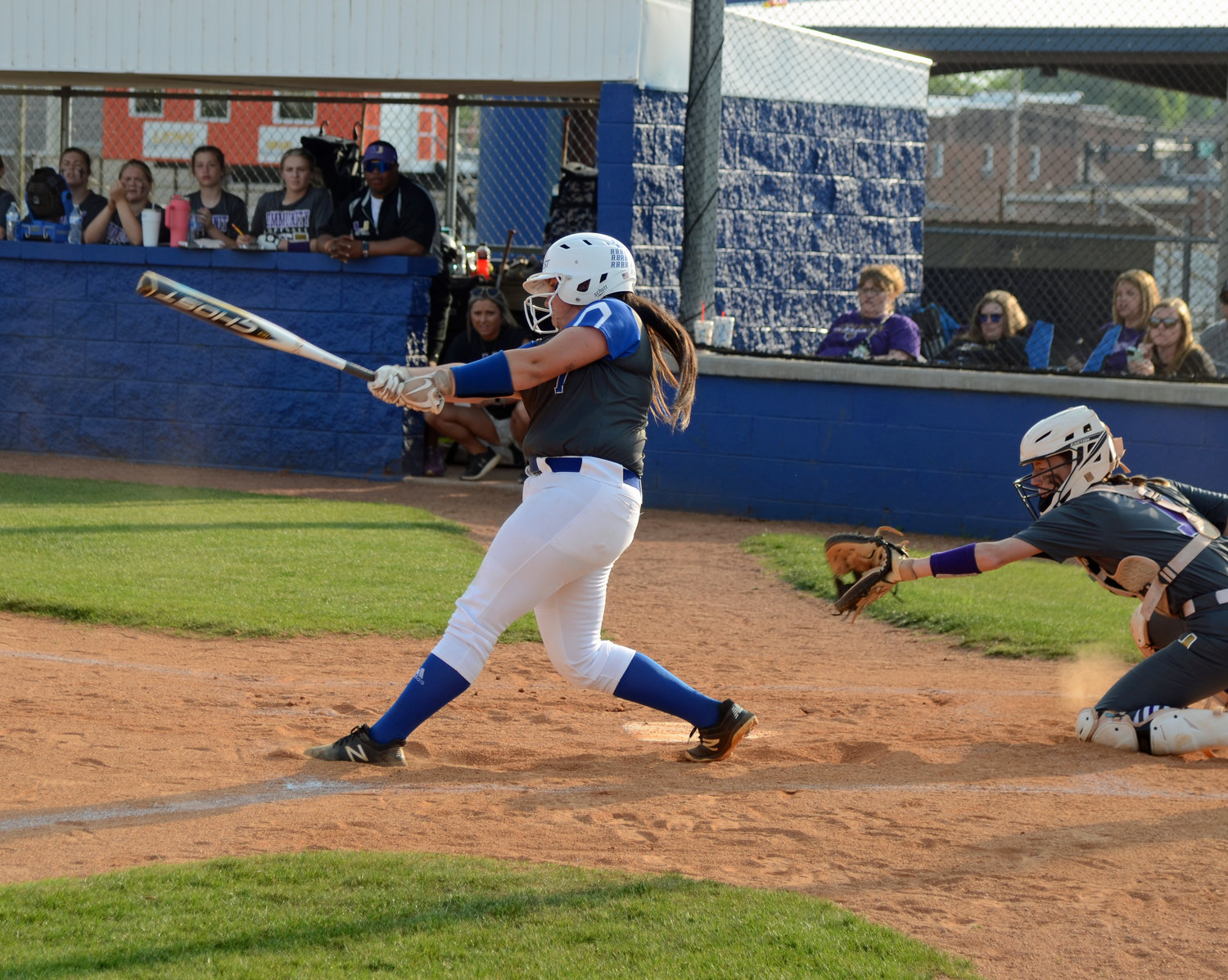 Carli Warner drives in a run to open the scoring in the bottom of the first inning.