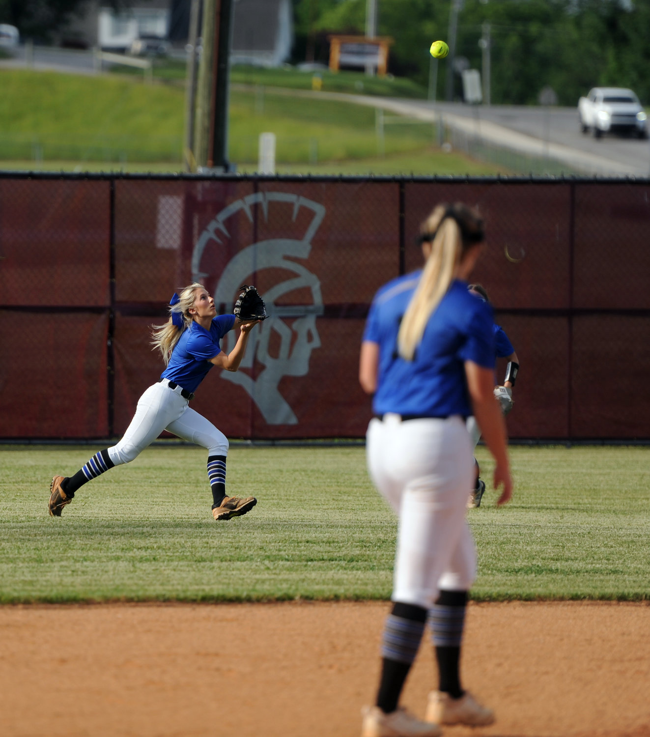 Tigerette center fielder Olivia Wooten dashes to record an out in the bottom of the third inning.