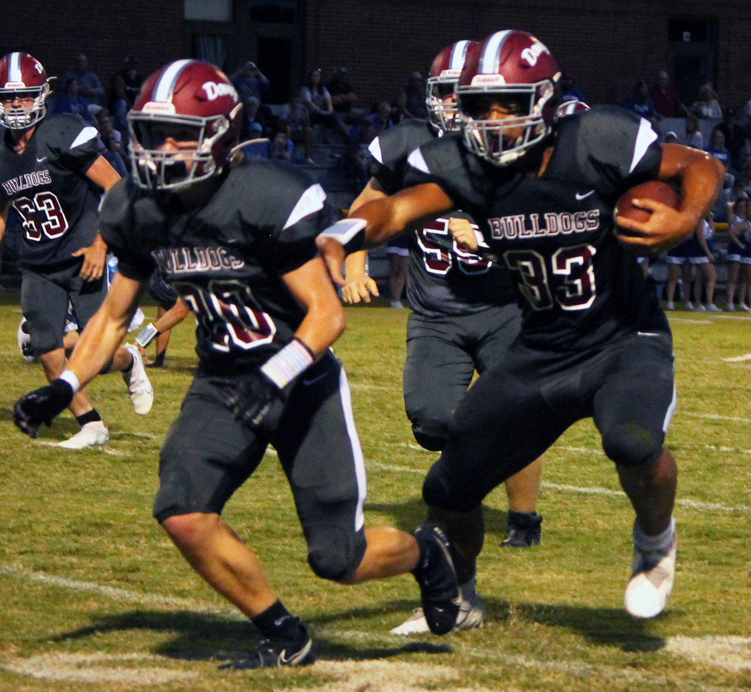 Running back Ben Franklin follows his blockers on a first down run against Huntland Friday night. Franklin had one touchdown on the night. 