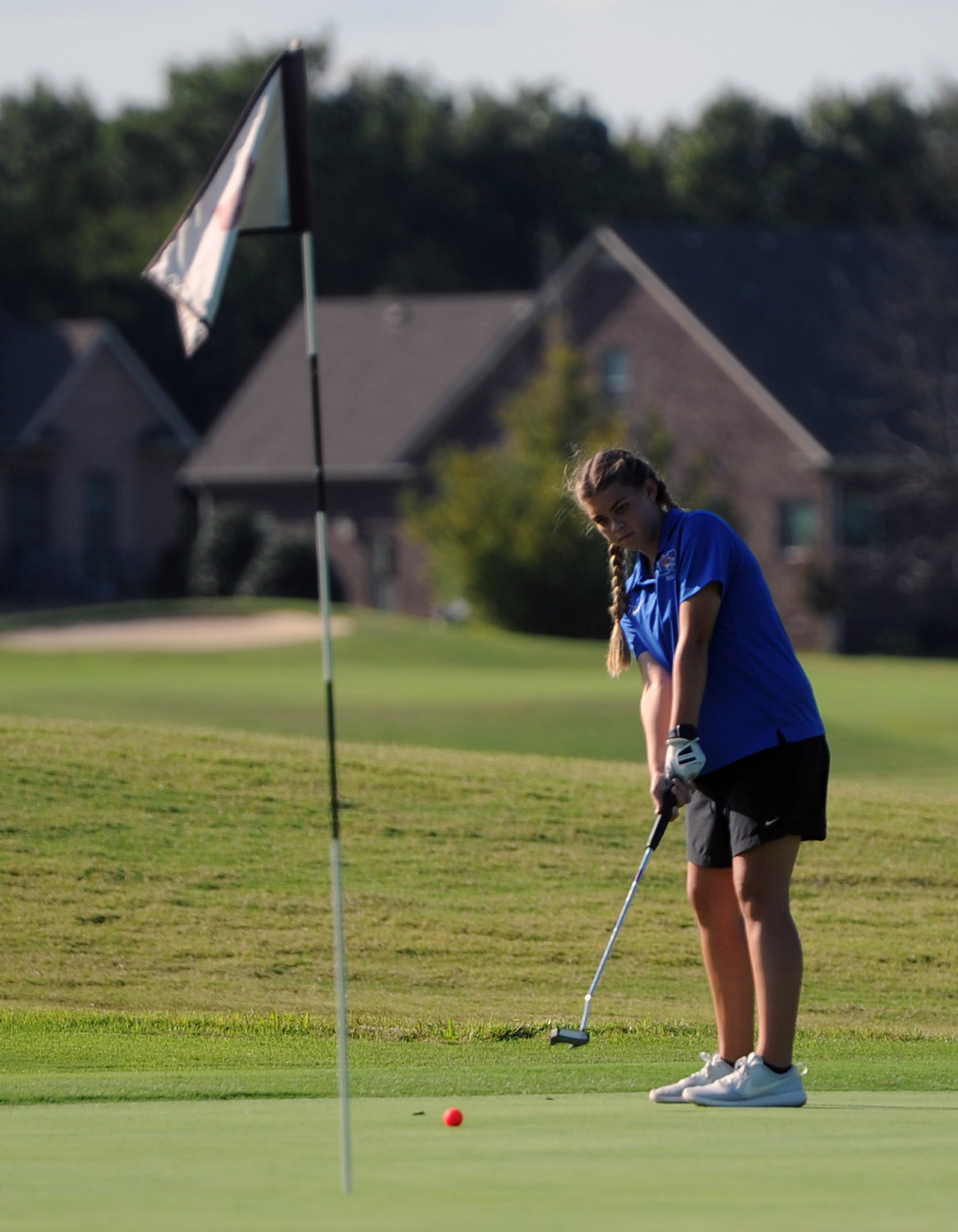 Marshall County’s Nellie Neece lines up her putt on Hole 9 at Saddle Creek.