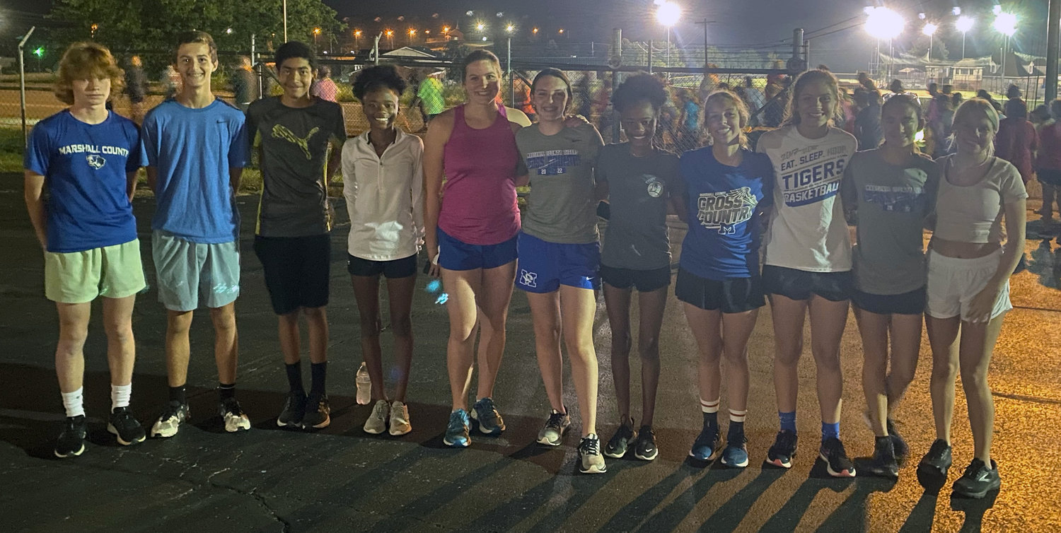 Members of the Marshall County cross country team led the way during the run on Friday morning. Those who participated are (from left) Aydan Cook, Jacob Wakham, Terrence Bishop, Kamaria Johnson, Aliyah Wenneker, Kendall Adams, Kamea Johnson, Karlie Lohr, Maggie Steely, Abigail Haley, and Olympia Cathey.