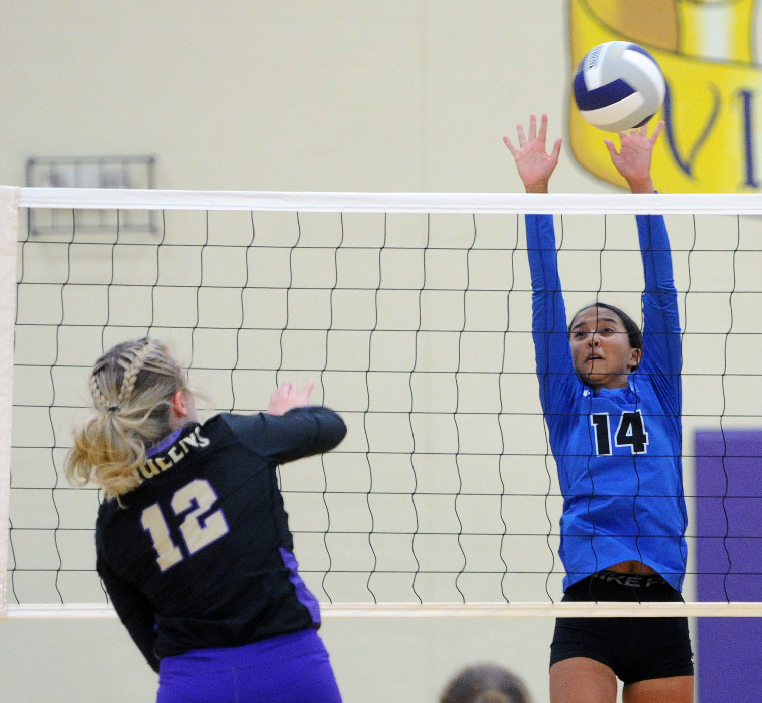 Autumn Sweatt (14) goes up tall for a block on a shot against Community.