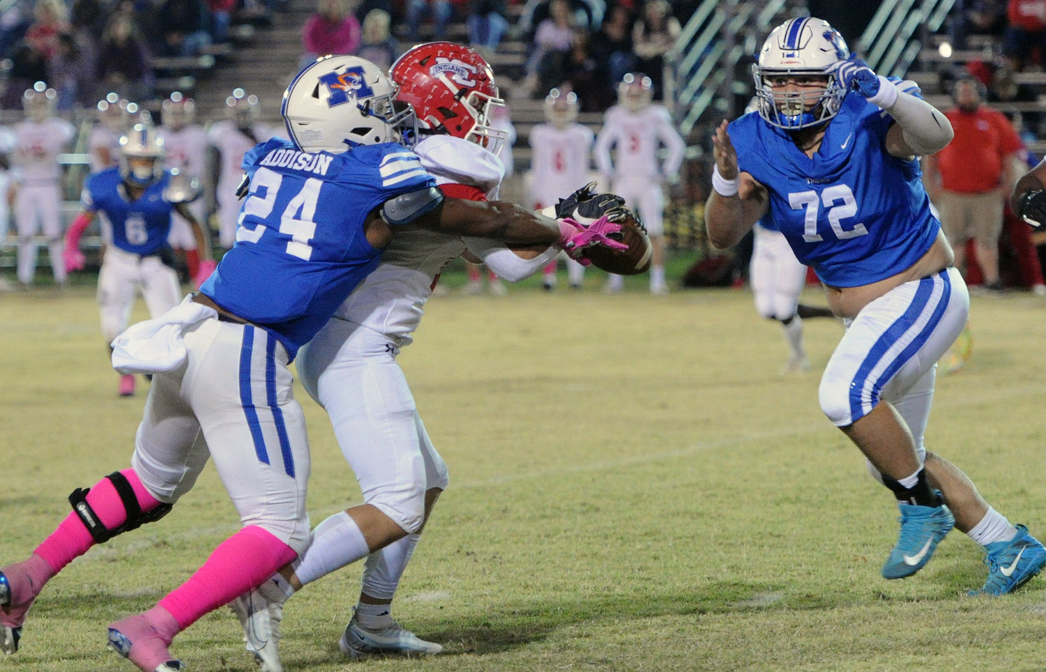 Lavonte Addison (24) and Anthony Diaz (72) converge to make the stop for the Tiger defense.