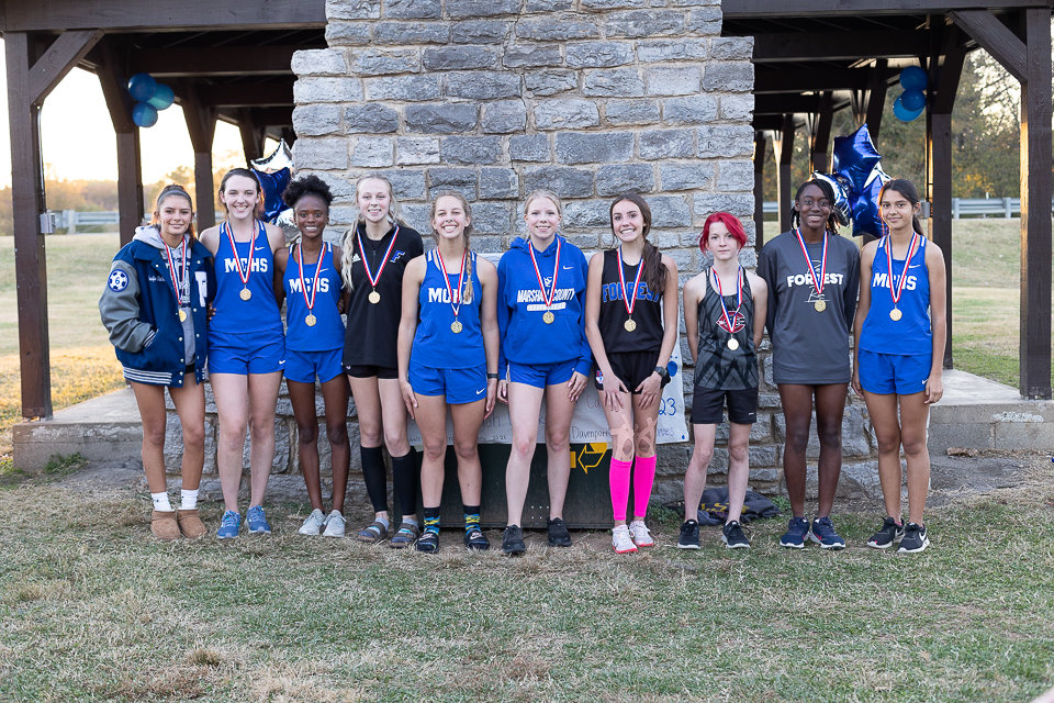 Girls top ten winners pose with their medals.