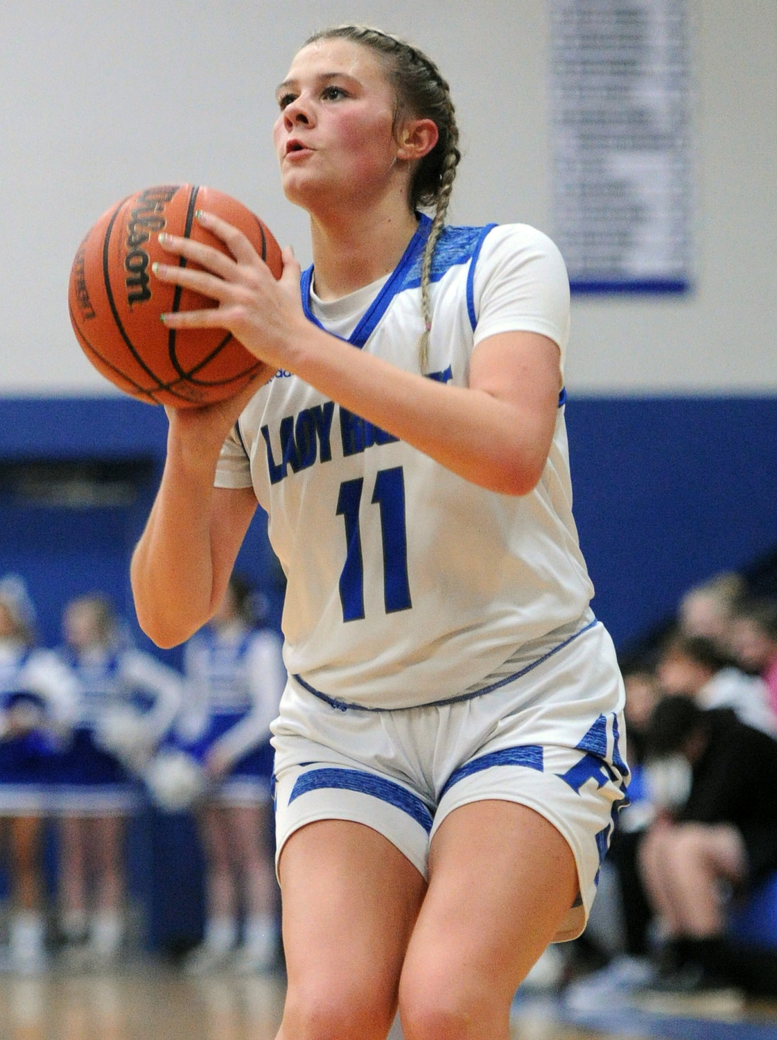 Kinslee Inlow takes aim and fires a three-pointer. She scored 10 points against the Raiderettes.