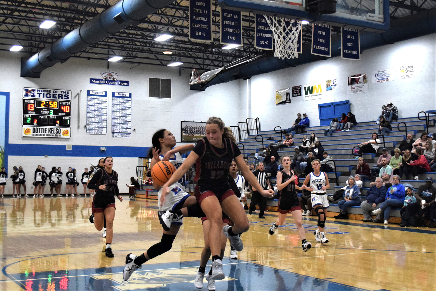Marshall County’s Kayla Keiler drives toward the hoop.