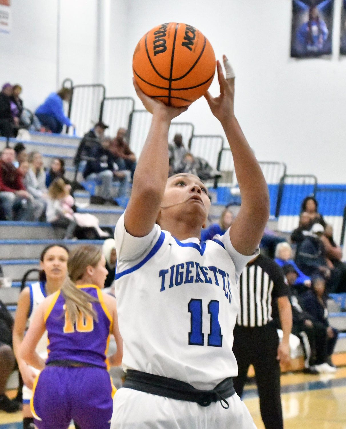 Demiyah Blackman scores in the opening quarter for the Tigerettes. Blackman led Marshall County with 20 points.