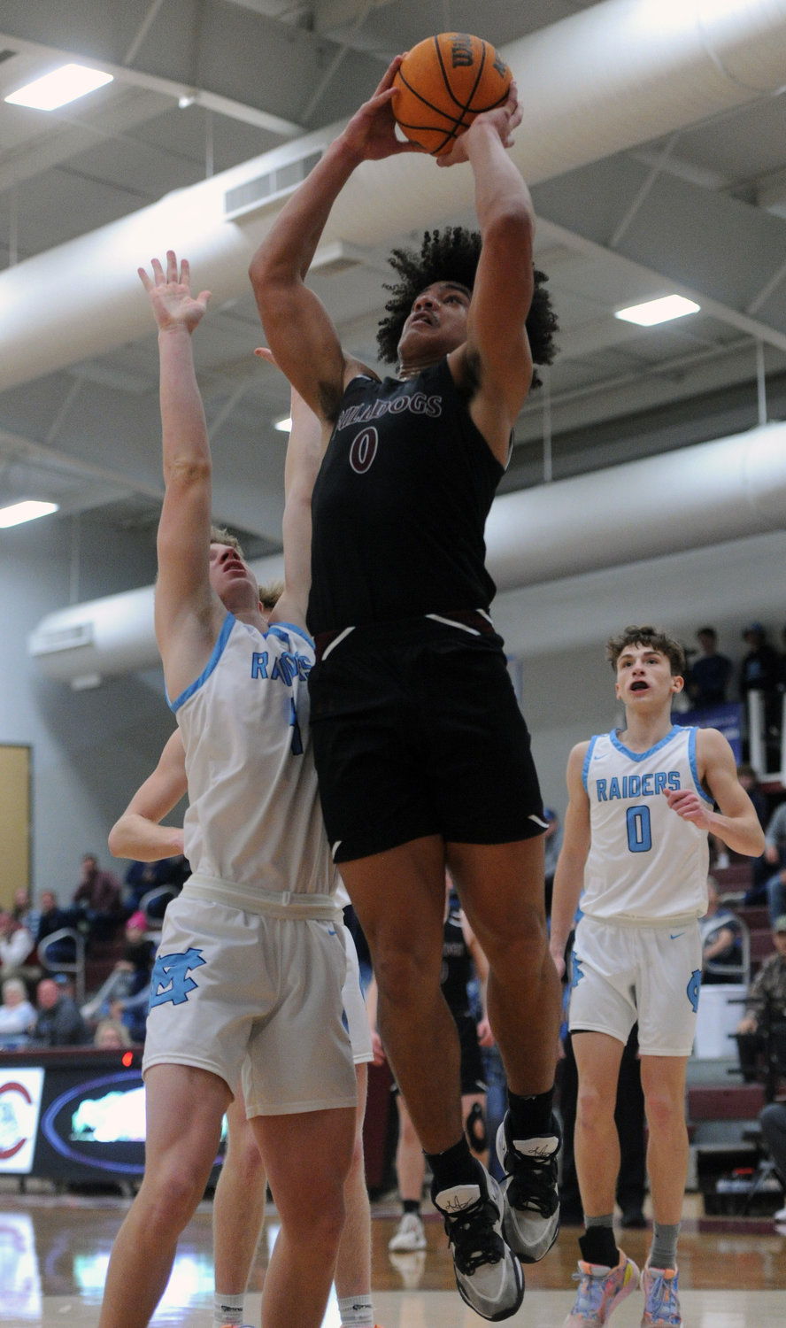Ben Franklin muscles his way to the rim on a put-back and scores for the Bulldogs. He scored 13 points on Monday night.